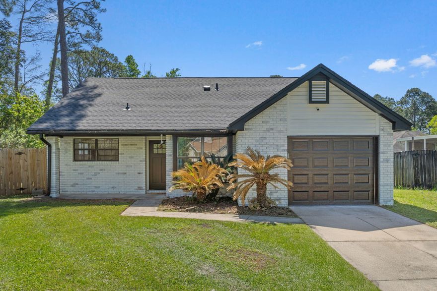 Welcome to 2106 Wilderness Path - a cozy and inviting 3-bedroom, 2-bathroom home that offers both comfort and convenience in the heart of Fort Walton Beach. Step inside to discover a modern kitchen outfitted with stainless steel appliances, perfect for whipping up your favorite meals. The open layout is enhanced by tall ceilings and an abundance of natural light, giving the home a bright and spacious feel. Washer and dryer hookups are available, providing flexibility for in-home laundry. The home also features a one-car garage, ideal for parking or additional storage needs. Enjoy the outdoors in your fully fenced backyard - perfect for entertaining, gardening, or letting pets roam freely. Located in a prime area, this home offers easy access to shopping, dining, schools, and the beautiful beaches of the Emerald Coast. Whether you're a first-time homebuyer, an investor, or looking to downsize, this home is a fantastic opportunity. Don't miss your chance to make 2106 Wilderness Path your new address!