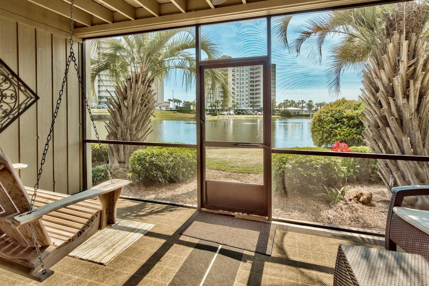 Rare opportunity to own a fantastic ground floor condo within Seascape Boardwalk Villas - a prime location of Seascape Resort just steps away from the beach boardwalk. This unit is directly on Stewart Lake and offers serene views from the living area & private screened-in porch. Beautiful tropical landscaping surrounds the unit & is covered by the HOA! This fully furnished & decorated 1-bedroom condo has an open floor plan and spacious master bedroom. This is the perfect second home, full time residence or vacation rental investment to enjoy the coastal lifestyle we all crave. With the new Seascape Resort Towne Center including Acme Oyster House, a charming coffee shop, dining & entertainment, an aerial entertainment ropes course and outdoor events plaza - everything is at your fingertips!