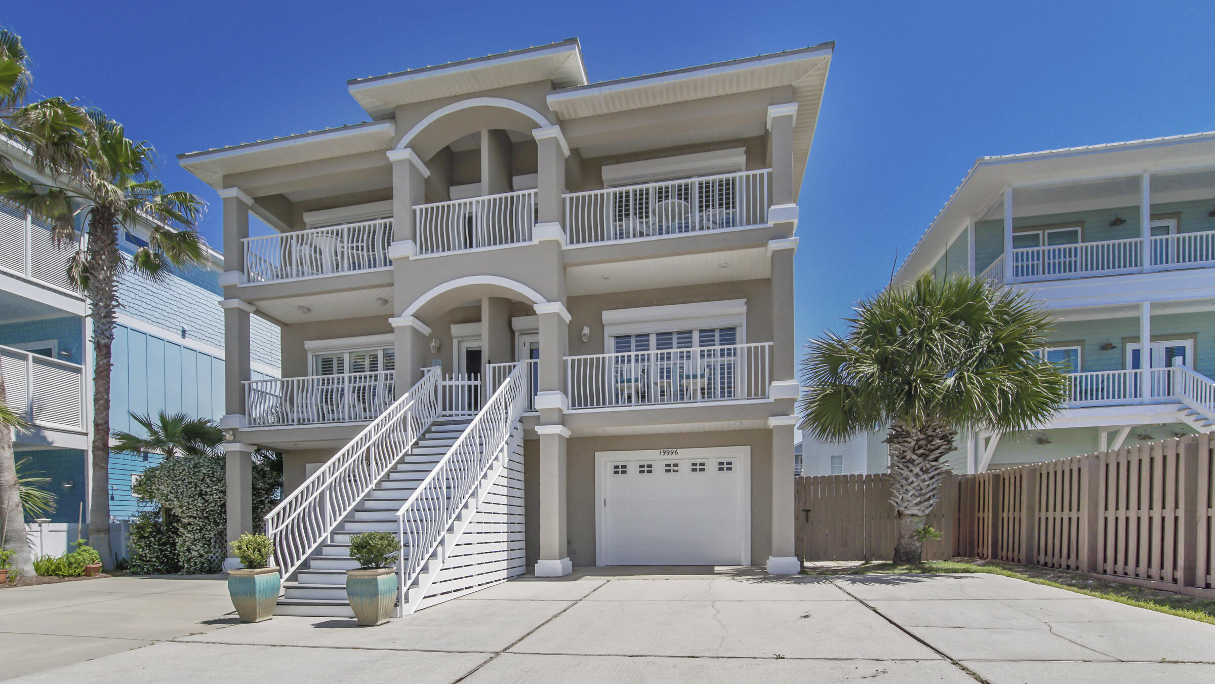 GULF VIEWS galore! Beautiful townhome in Laguna Beach with garage and ELEVATOR! NO HOA, across the street from the beach! Home is selling fully furnished! 1st floor laundry room and Guest quarters with spacious bedroom, full bath, and full kitchen! 2nd floor offers a bedroom, full bath, and open concept floorplan for the kitchen/dining/living area with balcony. 3rd floor is home to a bedroom with full bath, hall laundry with stackable washer/dryer hookup, and a large master suite with balcony. Plenty of natural light in this home! Interior plantation shutters for a luxurious affect in the kitchen, living, and master bedroom. The owners have taken excellent care of this home!