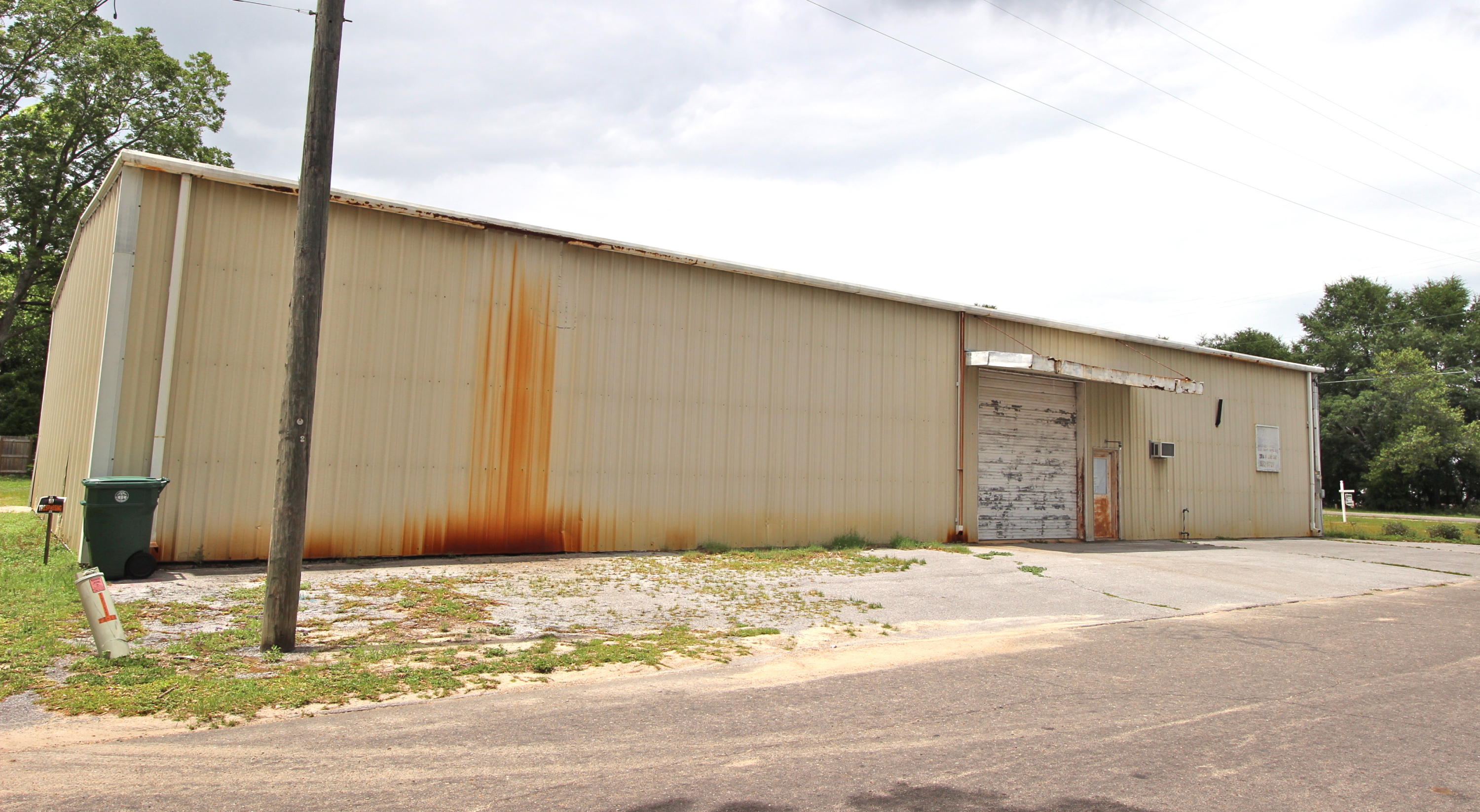 Formerly DeFuniak Wholesale, this DeFuniak icon is now available for sale. Adjacent and in addition to the 5000sf warehouse, there are 2 actively rented houses and 1 fixer upper for a total of 4 lots totaling 3/4 acre. The warehouse + the 2 houses on W Live Oak are zoned C1. The house on S 17th is zoned R2 (all 4 parcels have FLUM of medium density res). The warehouse has a rollup door, 1 office with 2 half baths. Also, what some may remember as ''the candy room'' - a well insulated, self contained room within the warehouse. Office building, antique mall or simply storage for your current inventory are a few possible uses. Rentals currently bring in appx. $800/month total but being zoned C1 commercial, the sky is the limit to the different ways this could all come together. Sold As Is.