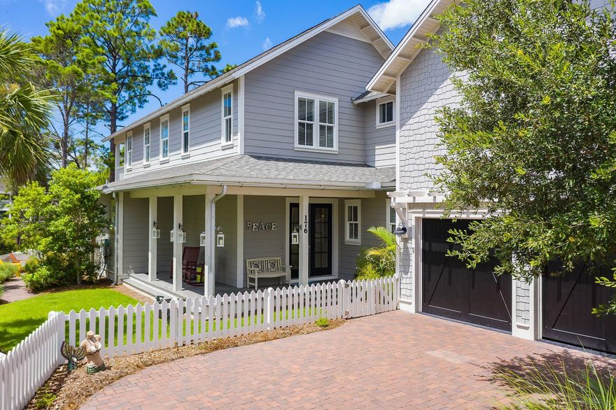 This 4 bedroom, 4 1/2 bath home located in the gated community of Watersound West Beach is the beach home you have been looking for. This home offers a coveted 2 car garage and ample parking in the driveway and is a short walk to the neighborhood pool and boardwalk to the beach.  The open floor plan is great for entertaining or family gatherings. The kitchen offers an oversize island finished with a brown - golden agate countertop.  This exclusive slab surface is very unique in semi precious gemstone agate.  The kitchen has ample cupboard space, a large pantry under the stairs, stainless GE appliances to include a gas range and stainless steel range hood. The home offers wood flooring throughout along with white shiplap walls.  The home also offers a wet bar with a stainless steel beverage