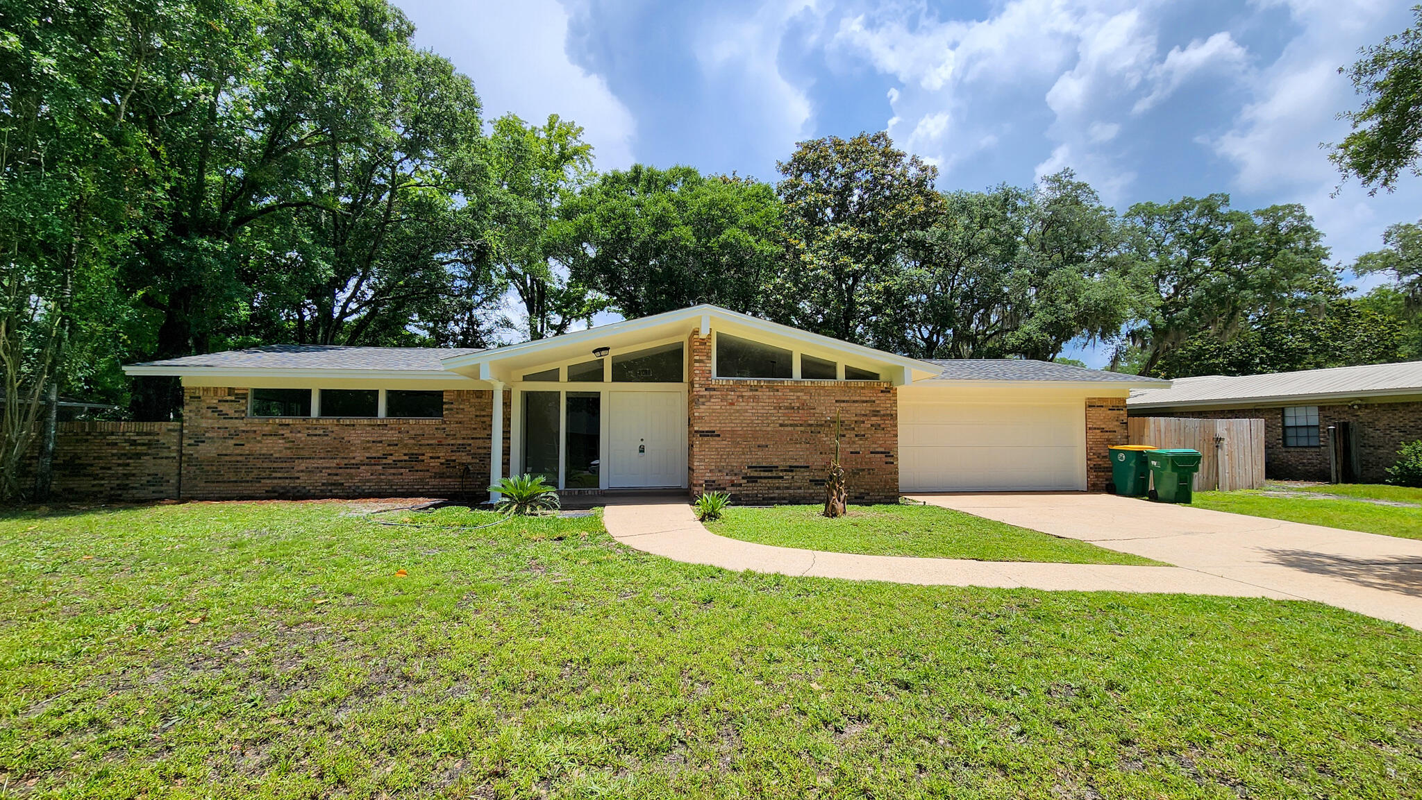 Step into this beautifully renovated 3-bedroom, 2- bathroom brick home!! Every inch of the interior has been thoughtfully updated, offering modern comforts with timeless charm. Inside, you'll find a stunning new white kitchen featuring sleek cabinetry, quartz countertops, and updatedappliances! Both bathrooms have been completely refreshed with contemporary finishes, and new flooring flows throughout the home, tying each space together with style and warmth. Bright new light fixtures add a modern touch, while large windows allow natural light to pour in. Relax year-round in the Florida room, ideal for enjoying morning coffee or unwinding in the evening. Additionally, the home has been completely rewired to code in 2025 & Roof was install in 2017. This move-in ready home combines quality updates with a fantastic location within close proximity to schools, shopping, and the beach. Don't miss your opportunity to own a fully remodeled home in a wonderful community!
