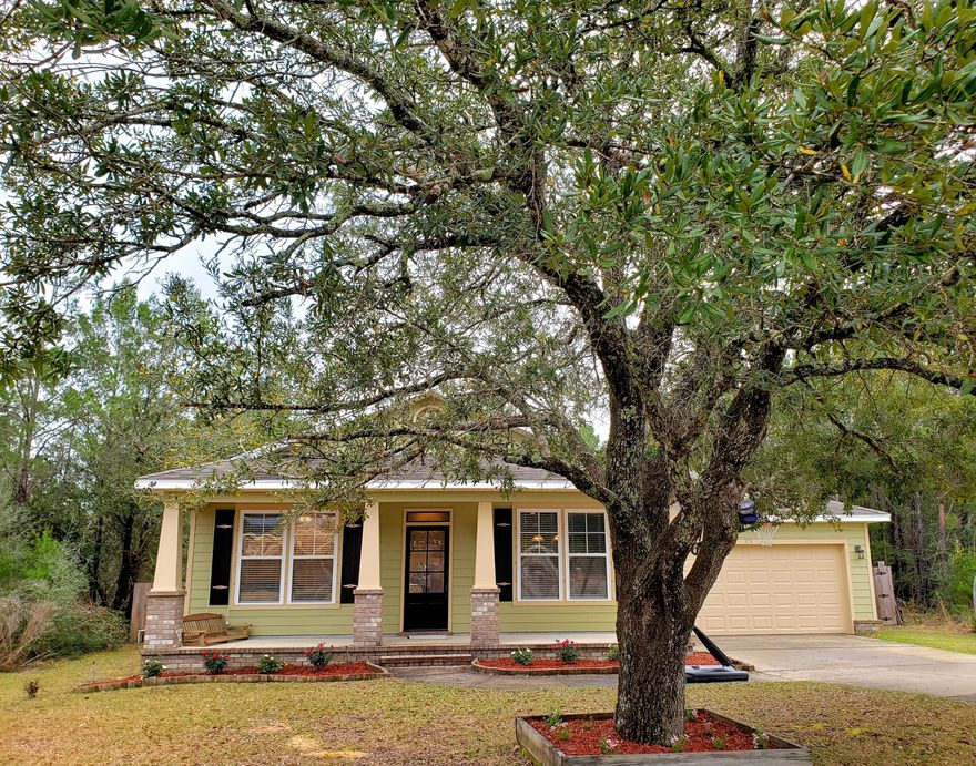 Beautiful Craftsman Style home built by Greg Goodwin a 3/2 with screened back porch and a large deck. Home features high ceilings, upgraded cabinets in kitchen, cased windows. tankless hot water, hardy board siding all freshly painted, new carpet. upgraded ladder back doors, attached garage and large pole barn. Privacy fenced yard has a lawn pump and sprinkler system. Home is located close to schools. Call for your private showing.
