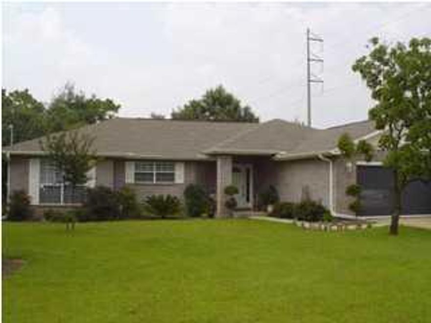 STUNNING CONTEMPORARY BRICK HOME SITUATED ON A LARGE CORNER LOT IN THE HOLLEY BY THE SEA COMMUNITY WITH LOTS OF AMENITIES! Open and spacious great room with cathedral ceiling, tiled corner fireplace with accent mirror and recessed light above the mantle, plant ledges and a sliding glass door that leads you to your all weather enclosed Florida room. Sitting area off the living area. Formal dining room with arched doorways that set it apart from the living area. You'll love this kitchen with lots of cabinets and counter space, upgraded appliances, pantry and center island with power and breakfast bar. Master bedroom suite and bath with double vanities, garden tub, separate shower and two walk-in closets. Split bedroom floor plan allows for privacy from the kids or guests. Large inside laundry room complete with a utility sink.  Holley by the Sea is a reflection of your lifestyle.  Perfect home for your family... close to military bases, restaurants, airports, beaches, shopping, churches and great schools.