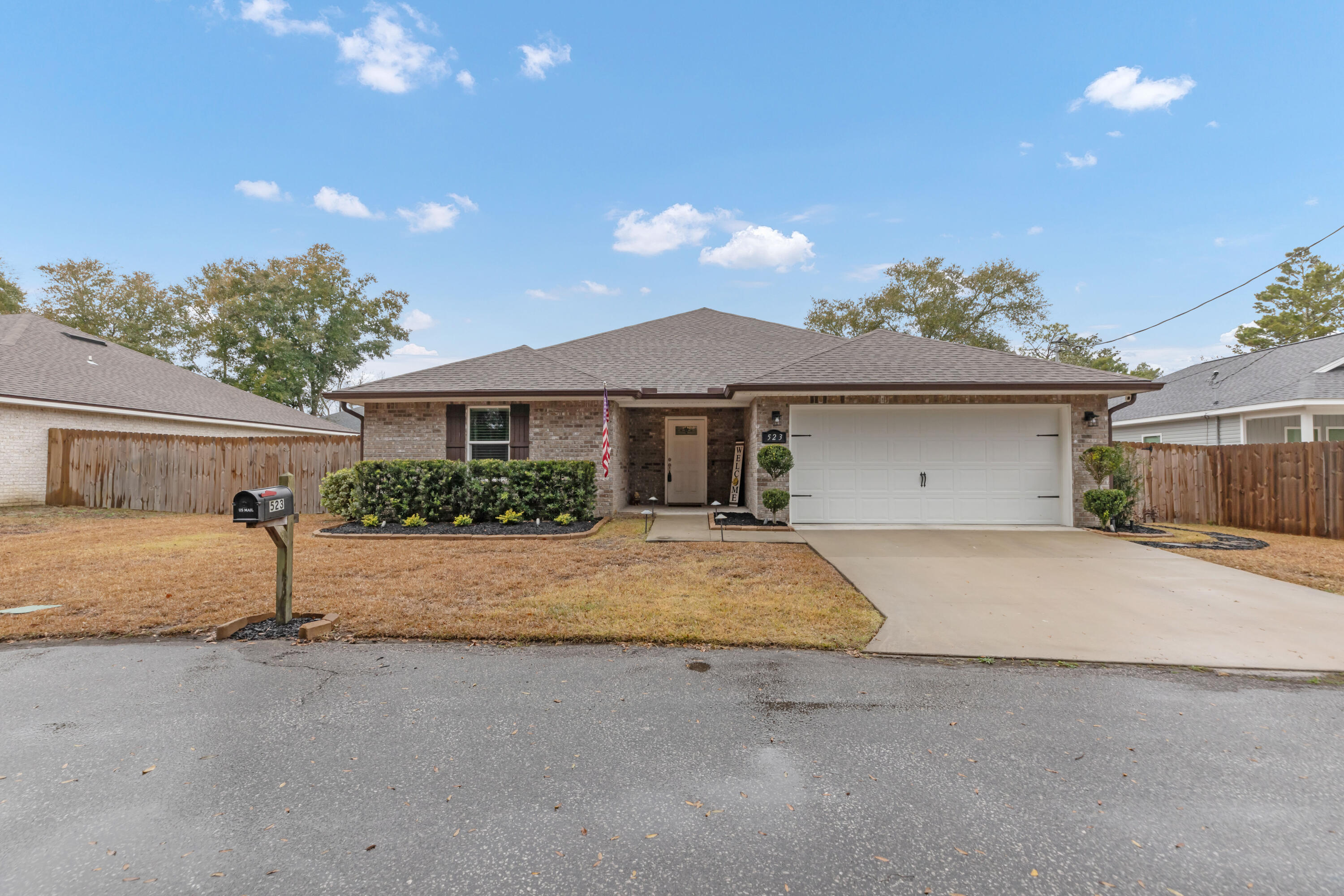Built in 2022, this stunning Mary Esther home offers modern living with peace of mind, as all major systems are less than three years old! Located less than 5 minutes from Hurlburt Field and just 14 minutes from Navarre Beach, it features 11-foot ceilings in the living room, crown molding throughout, and tray ceilings in the master bedroom and living room. The kitchen features granite countertops, stainless steel Whirlpool appliances, and luxury vinyl plank flooring, which flows throughout the home. Bathrooms are finished with porcelain tile, and the two-car garage includes epoxy flooring. The split floor plan offers privacy, and the washer and dryer convey with the home. This move-in-ready property combines elegance and functionality. Survey available. Schedule your showing today!