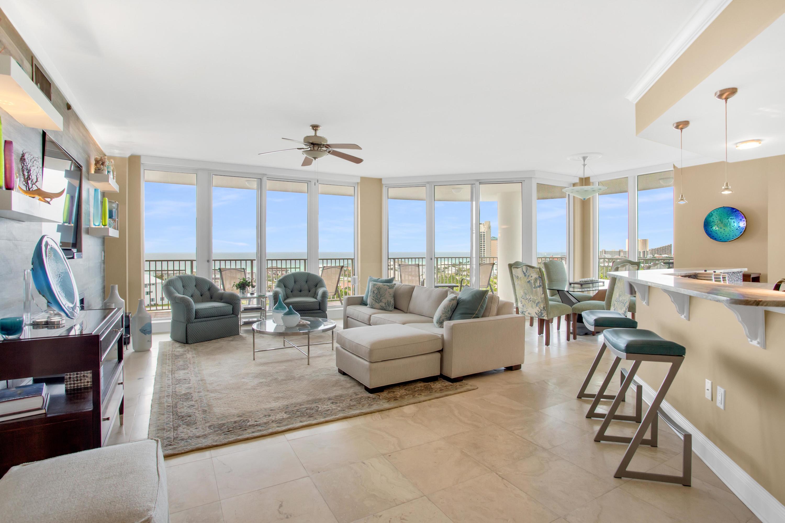 Immerse yourself in views from this 9th floor private residence located in the exclusive One Beach Club Drive condominium. The current owners spared no expense in updates, from contemporary power shades on the south facing windows to a Toto Neorest automatic toilet/bidet in the Master Bathroom. The spacious floor plan encompasses four bedrooms, four updated bathrooms, an open living area with expansive views of  the beach, and a fully remodeled kitchen. The kitchen was extensively upgraded in 2015 and features an Electrolux stove, oven, and microwave, Kenmore double drawer dishwasher, and Samsung refrigerator.  The living room exemplifies luxury with a focal wall that includes up-lit floating shelves, inset flat screen TV, and electric fireplace.