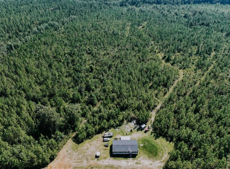 North Baker Home on 16 Acres!Enjoy the perfect mix of comfort and outdoor living with this 3-bedroom, 2-bath 2020 model mobile home featuring 1,800 sq ft and a spacious split floor plan. The open concept design makes it easy to entertain, host gatherings, and stay connected with family. The covered back deck offers the perfect spot to unwind and recharge while taking in the quiet evening air. Nestled on 16 acres, the property offers room to roam, hunt, and play ideal for recreation or simply enjoying the peace and privacy of country living. Don't miss this opportunity to own your own slice of Baker!