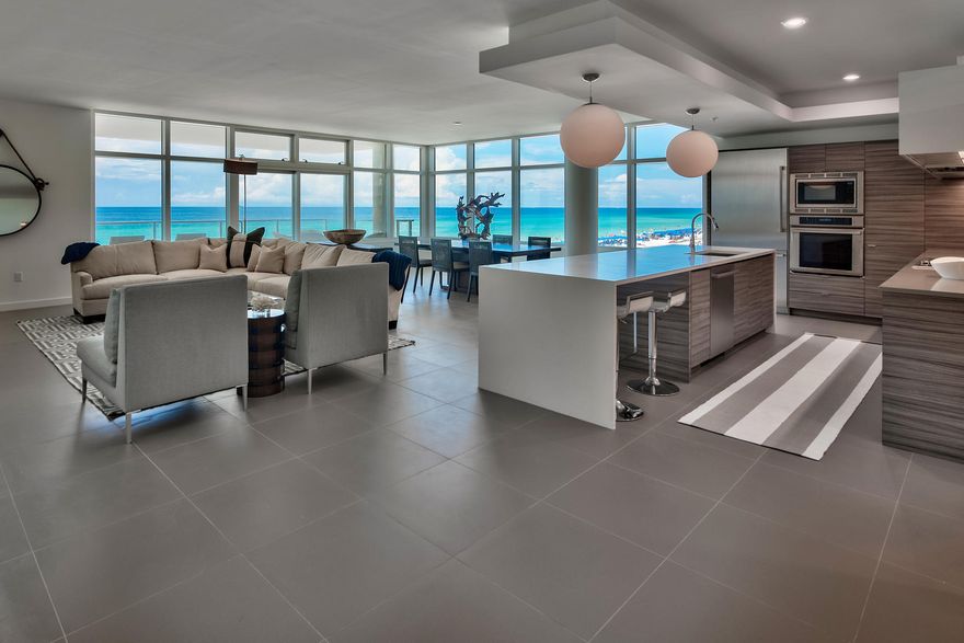 1900 Ninety Eight is Destin, Florida's first Gulf front condominium developed since 2007. Each exquisitely designed luxury residence features a panoramic view of the Gulf of Mexico from its private, 12-foot deep balcony equipped with an electric grill. The open plan with clean, flowing lines invites beams of natural light inside through an expansive wall of windows. Interior design elements that include custom cabinetry, marble and quartz countertops, Thermador kitchen appliances and porcelain stone floor tile makes this three bedroom, three bath residence truly incredible. Amenities include a rooftop pool, spa, fire pit & state of the art fitness center, along with gated entry, heated and cooled elevator and lobby areas and two levels of parking beneath the residences.