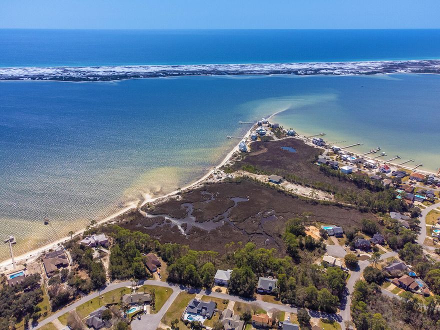 Build Your Dream Home with Stunning Water Views! This .29-acre lot offers unobstructed views of the Sound with the Gulf of America in the distance, all at a fraction of the cost of direct waterfront property. Imagine starting your day with breathtaking sunrises, unwinding on your private balcony, and soaking in vibrant sunsets over the water.With space for a second or third-story home, you can maximize the panoramic views and coastal breezes. Conveniently located to shopping, top-rated schools, and Hurlburt Field Air Force Base, this lot combines tranquil Gulf Coast living with easy access to everyday essentials.Don't miss this opportunity to bring your vision to life in this exceptional location. Call today for additional details and walk the lot with your favorite Realtor(r)!