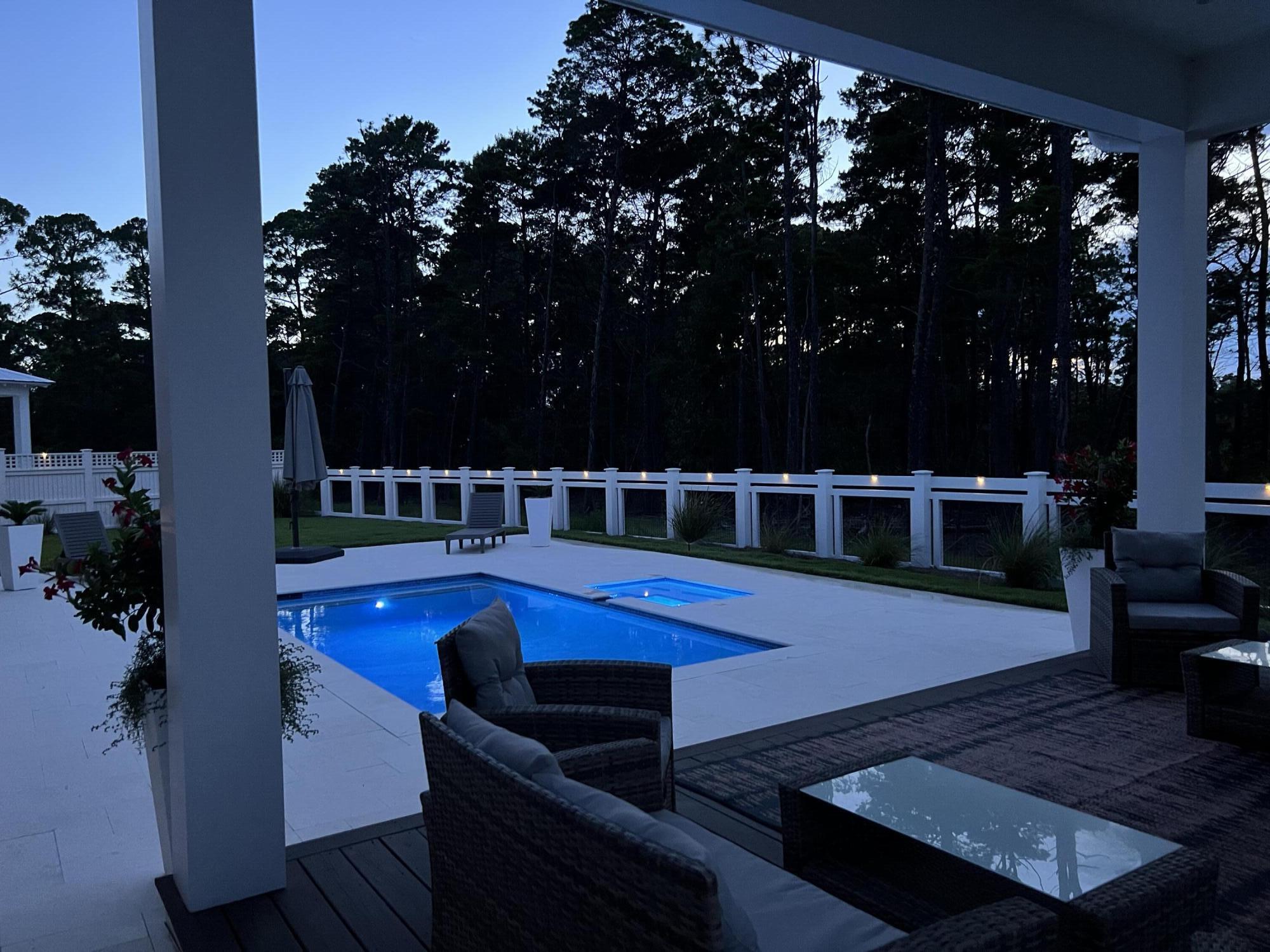 MORE PICS COMING SOON!Why wait to build in Watersound Origins when you can have this better than new one-of-a-kind Romair home now with extensive upgrades at a price point $150,000 - $200,000 less than new when compared to comparable recent sales! The comparable sales are same builder, same plan, same street, all within 90 days of sale.The must-see feature of this home is the premium lot with a huge backyard oasis (largest yard in the neighborhood) backing up to a nature preserve with a breathtaking salt water pool, spa, cabana, wood burning fireplace, large screened in patio, and privacy fence around the entire back yard. This masterpiece is a stunning and unique single level home designed by Romair Construction built on the most popular Duxbury Plan. This beautiful residence offers four bedrooms, 4 1/2 bathrooms, plus an office/workout room, providing ample space for your family, work, and relaxation needs.
The highly desirable upgrades in this home include:
Premium lot with oversized backyard backing up to nature preserve
Saltwater pool with spa
Cabana with outdoor fireplace and gas stub for grill
Screened in back patio
Plantation shutters and curtains throughout
Upgraded white oak cabinets throughout
Upgraded lighting package
Heated and cooled garage
Outdoor lighting in front and backyard
Extended driveway and parking pad
Irrigation system filter
Surge protector built into electrical system
Washer/Dryer
This home is less than 1 year old and is better than new with the upgrades and is in immaculate condition.
As you step inside, you'll be greeted by the 10-foot ceilings with 8-foot solid core doors and a seamless flow from the living area to the kitchen and dining space, perfect for entertaining and everyday living.
The attention to detail is evident in every corner of this home with strategically placed bedrooms throughout the home, offering privacy and tranquility. The kitchen is a chef's dream, featuring quartz countertops that add a touch of elegance and durability. The 36-inch dual fuel range, 36-inch French door cabinet panel refrigerator with bottom freezer, and cabinet panel dishwasher appliances by GE Monogram make cooking and entertaining a breeze.
Throughout the home, you will find many luxurious upgrades including the custom-designed cabinetry with a contemporary overlay and soft-close drawers and doors, designer-curated porcelain tile in all bathrooms with quartz countertops in the kitchen, bathroom and laundry room, and under cabinet lighting all add a luxurious touch. Enjoy the convenience of a single level living, where everything is easily accessible and there are no stairs to navigate. This makes the home suitable for all ages and abilities. The 2-car detached garage is conveniently located within close proximity to the laundry/mud room and separate from the main living area.
The Watersound Origins community is one of South Walton's most coveted neighborhoods for its exceptional amenities, beautiful new homes, and prime location. Amenities include the Village Commons pool & fitness center, sports courts including tennis and pickle ball, miles of nature trails, dock access to Lake Powell, unlimited golf, and lots of green space for outdoor play. The all new Watersound Town Center brings a new level of excitement and convenience to the community with a Publix Super Market, delicious restaurants, healthcare facilities, a seasonal weekly Farmers Market, and more right at the entrance to the neighborhood!