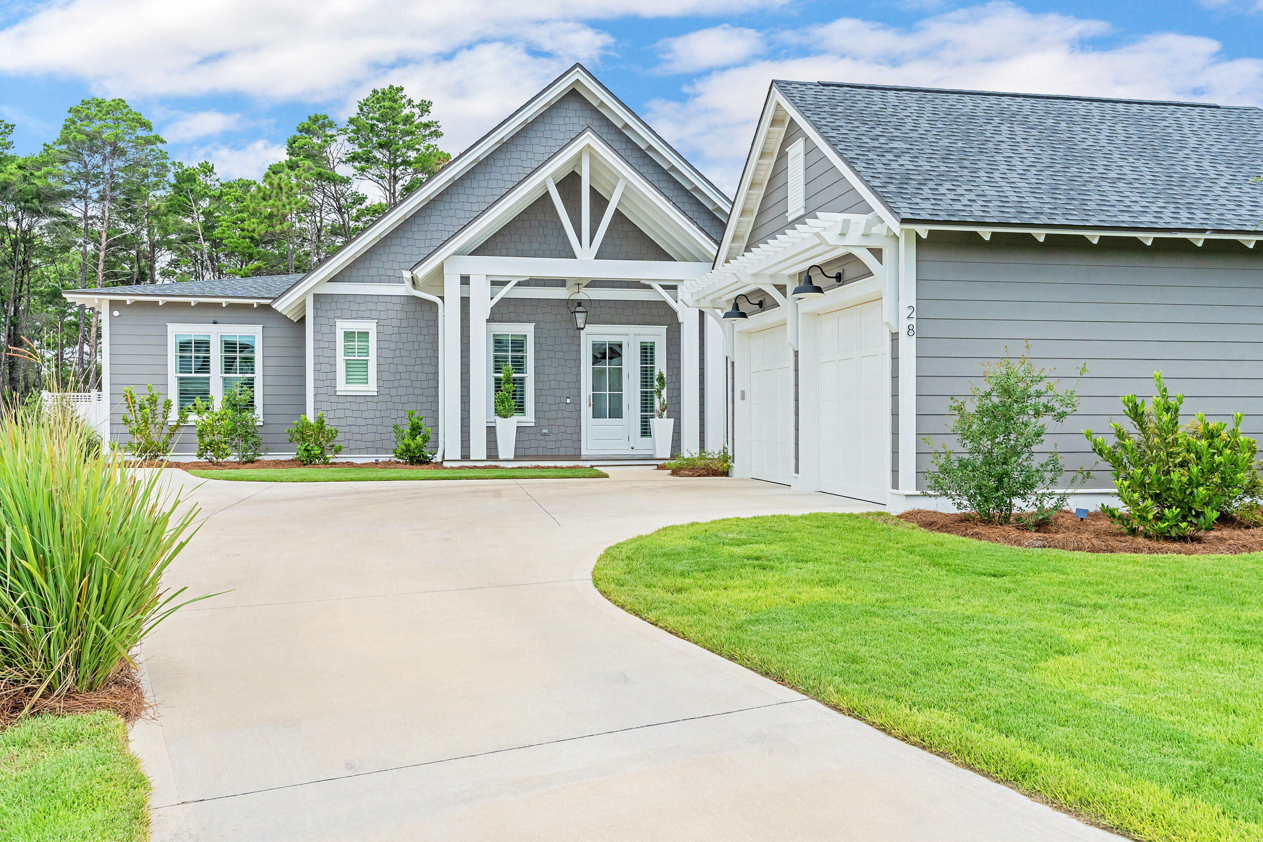 Welcome to 28 Pollard Cove West, the ONLY Romair built home with the Duxbury plan currently on the market. And here is the best part, it is like-new with extensive upgrades and priced $150,000 - $200,000 less than recent comparable sales with the same builder, same plan, same street, all within 90 days. The must-see feature of this home is the premium lot with a huge backyard oasis (largest yard in the neighborhood) backing up to a nature preserve with a breathtaking salt water pool, spa, cabana, wood burning fireplace, large screened in patio, and privacy fence around the entire back yard.
This masterpiece is a stunning and unique single level home offering four bedrooms, 4 1/2 bathrooms, plus an office/workout room, providing ample space for your family, work, and relaxation needs.
The highly desirable upgrades in this home include:
Premium lot with oversized backyard backing up to nature preserve
Saltwater pool with spa
Cabana with outdoor fireplace and gas stub for grill
Screened in back patio
Plantation shutters and curtains throughout
Upgraded white oak cabinets throughout
Upgraded lighting package
Heated and cooled garage
Outdoor lighting in front and backyard
Extended driveway and parking pad
Irrigation system filter
Surge protector built into electrical system
This home is less than 1 year old and is better than new with the upgrades and is in immaculate condition. As you step inside, you'll be greeted by the 10-foot ceilings with 8-foot solid core doors and a seamless flow from the living area to the kitchen and dining space, perfect for entertaining and everyday living.
The attention to detail is evident in every corner of this home with strategically placed bedrooms throughout the home, offering privacy and tranquility. The kitchen is a chef's dream, featuring quartz countertops that add a touch of elegance and durability. The 36-inch dual fuel range, 36-inch French door cabinet panel refrigerator with bottom freezer, and cabinet panel dishwasher appliances by GE Monogram make cooking and entertaining a breeze.
Throughout the home, you will find many luxurious upgrades including the custom-designed cabinetry with a contemporary overlay and soft-close drawers and doors, designer-curated porcelain tile in all bathrooms with quartz countertops in the kitchen, bathroom and laundry room, and under cabinet lighting all add a luxurious touch. Enjoy the convenience of a single level living, where everything is easily accessible and there are no stairs to navigate. This makes the home suitable for all ages and abilities. The 2-car detached garage is conveniently located within close proximity to the laundry/mud room and separate from the main living area.
The Watersound Origins community is one of South Walton's most coveted neighborhoods for its exceptional amenities, beautiful new homes, and prime location. Amenities include the Village Commons pool & fitness center, sports courts including tennis and pickle ball, miles of nature trails, dock access to Lake Powell, unlimited golf, and lots of green space for outdoor play. The all new Watersound Town Center brings a new level of excitement and convenience to the community with a Publix Super Market, delicious restaurants, healthcare facilities, a seasonal weekly Farmers Market, and more right at the entrance to the neighborhood!