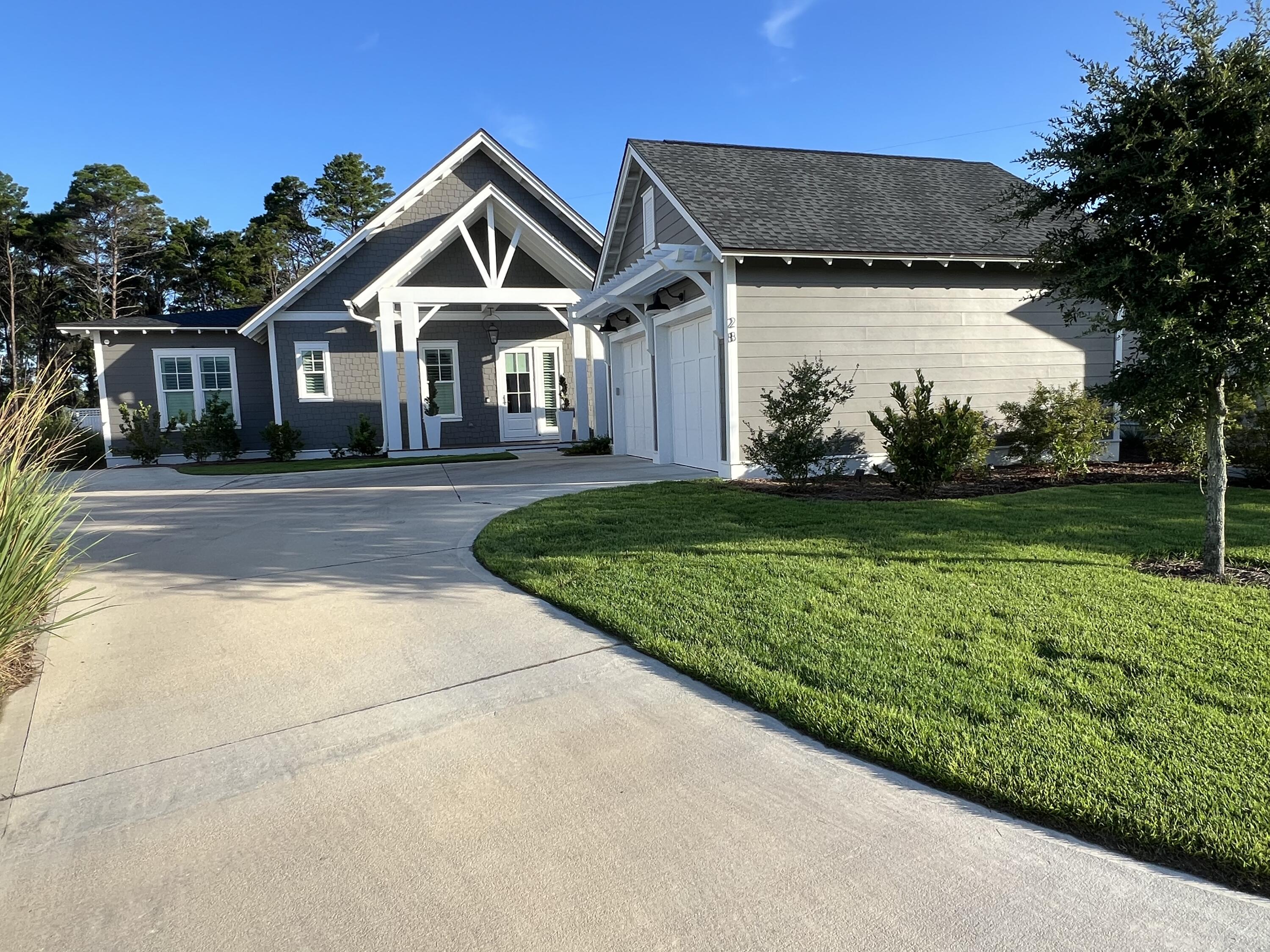 WHY WAIT OVER A YEAR FOR A NEW BUILD AND PAY $150,000 - $200,000 MORE WHEN YOU CAN HAVE THIS GORGEOUS LIKE-NEW HOME NOW FOR MUCH LESS? Welcome to 28 Pollard Cove West, the ONLY Romair built home with the highly sought-after Duxbury plan currently on the market. And here is the best part, it is like-new with extensive upgrades and priced $150,000 - $200,000 less than recent comparable sales with the same builder, same plan, same street, all within 90 days (ask us for the details). As a bonus and also included is a 1 year home warranty! The must-see feature of this home is the premium lot with a huge backyard oasis (largest yard in the neighborhood) backing up to a nature preserve with a breathtaking salt water pool, spa, cabana, wood burning fireplace, large screened in patio, and privacy fence around the entire back yard.
This masterpiece is a stunning and unique single level home offering four bedrooms, 4 1/2 bathrooms, plus an office/workout room, providing ample space for your family, work, and relaxation needs.
The highly desirable upgrades in this home include:
Premium lot with oversized backyard backing up to nature preserve
Saltwater pool with spa
Cabana with outdoor fireplace and gas stub for grill
Screened in back patio
Plantation shutters and curtains throughout
Upgraded white oak cabinets throughout
Upgraded lighting package
Heated and cooled garage
Outdoor lighting in front and backyard
Extended driveway and parking pad
Irrigation system filter
Surge protector built into electrical system
This home is less than 1 year old and is better than new with the upgrades and is in immaculate condition. As you step inside, you'll be greeted by the 10-foot ceilings with 8-foot solid core doors and a seamless flow from the living area to the kitchen and dining space, perfect for entertaining and everyday living.
The attention to detail is evident in every corner of this home with strategically placed bedrooms throughout the home, offering privacy and tranquility. The kitchen is a chef's dream, featuring quartz countertops that add a touch of elegance and durability. The 36-inch dual fuel range, 36-inch French door cabinet panel refrigerator with bottom freezer, and cabinet panel dishwasher appliances by GE Monogram make cooking and entertaining a breeze.
Throughout the home, you will find many luxurious upgrades including the custom-designed cabinetry with a contemporary overlay and soft-close drawers and doors, designer-curated porcelain tile in all bathrooms with quartz countertops in the kitchen, bathroom and laundry room, and under cabinet lighting all add a luxurious touch. Enjoy the convenience of a single level living, where everything is easily accessible and there are no stairs to navigate. This makes the home suitable for all ages and abilities. The 2-car detached garage is conveniently located within close proximity to the laundry/mud room and separate from the main living area.
The Watersound Origins community is one of South Walton's most coveted neighborhoods for its exceptional amenities, beautiful new homes, and prime location. Amenities include the Village Commons pool & fitness center, sports courts including tennis and pickle ball, miles of nature trails, dock access to Lake Powell, unlimited golf, and lots of green space for outdoor play. The all new Watersound Town Center brings a new level of excitement and convenience to the community with a Publix Super Market, delicious restaurants, healthcare facilities, a seasonal weekly Farmers Market, and more right at the entrance to the neighborhood!
VIDEO AVAILABLE UPON REQUEST!