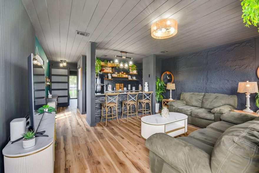 WOW!! This Top level unit overlooking the pool has been COMPLETELY RENOVATED in a Unique one of a kind Bohemian Design! Step into this eye catching unit that has been completely gutted and refurbished with NEW EVERYTHING including flooring, counter tops, all new kitchen appliances, new stack washer/dryer, New A/C unit, new slider to balcony, completely renovated bath with large walk-in shower and all new furnishings, accessories and kitchenware. There are designer touches through out featuring beautiful fluted wood paneling and textured wall accents. With only steps to the beach or time relaxing at the pool, this one is a MUST SEE! Give us a call and come visit....You will fall in Love!!