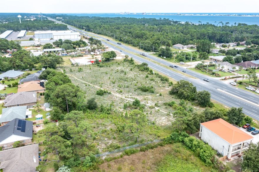 Opportunities are endless! 1.14 acres ideally located directly off of Highway 98! With over 162 feet of frontage on the main highway. Residential and commercial development surrounding and just minutes from all the Emerald Coast has to offer. Zoned commercial Planned Business District.