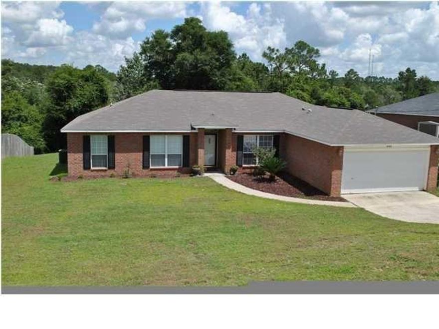 EAST NAVARRE ALL BRICK 4 BEDROOM & OFFICE! HUGE LOT ALMOST 1 ACRE FULLY FENCED. SPACIOUS HOME WITH GRANITE KITCHEN, OPEN FLOOR PLAN, BUFFET STYLE COUNTER WITH UNDERMOUNT SINK OVERLOOKING THE FAMILY ROOM, STAINLESS STEEL WHIRPOOL APPPLIANCES. THIS HOME FEATURES (3) EATING AREAS- A FORMAL DINING ROOM, BREAKFAST AREA W/ LARGE BAY-3 WINDOW AREA, AND THE BUFFET COUNTER. KITCHEN WITH RECESSED LIGHTING FEATURES PREMIUM MAPLE WOOD CABINETRY, STAGGERED CABINETS,GRANITE ISLAND, UPGRADED LUXURY VINYL PLANKS IN ALL WET AREAS (KITCHEN, HALLWAYS, LAUNDRY, BATHROOMS) AS WELL AS DINNING ROOM AND FAMILY ROOM, CARPET ONLY IN BEDROOMS, NON-POPCORN KNOCK-DOWN CEILINGS, AND PREMIUM INTERIOR DOORS W/ BRUSHED NICKLE COLOR HARDWARE.DOUBLE FRENCH DOORS LEADS FROM LIVING ROOM TO COVERED PORCH. OUTDOOR KITCHEN