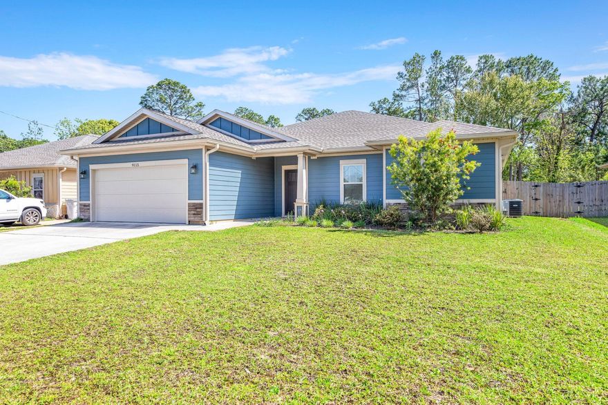 Beautiful East Navarre Craftsman style 4 bed 2 bath home sitting on .47 acres. As you enter the front door, a magnificently sized family room greets you with views of the stunning kitchen fully equipped with stainless steel appliances, granite countertops, beautiful shaker style cabinets, and a walk-in pantry. You will fall in love with the builders custom paint color that is accented with a wide baseboard, beautiful crown molding, and spectacular tray ceiling accents in the master bedroom, dining and entry area. With a desirable split floor plan, you can find the master bedroom to the left of the kitchen with a beautiful en suite bathroom, double vanities, separate tiled shower tub and marble garden tub, and an impressively sized walk-in closet. On the right side is three additional  bedrooms along with a second full bath. This lot features an expansive back yard that is deeper than the fence, covered patio and sprinkler system. You can't beat the location just miles from Navarre beach, shopping, and restaurants!  Buyer to verify any & all areas of importance