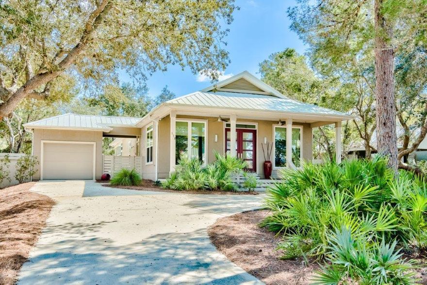 Immaculate, one-story Florida Cottage nestled on beautifully landscaped 1/4 acre site on low-traffic street short stroll to beach/access.  NO HOA! Exterior features include 1 car attached garage, outdoor patio/cooking area, oudoor shower, utility yard building/workshop.. Entire rear yard with fruit trees has privacy fence-great for pets and kids- a sitting area under the oaks and still plenty of room for a pool if desired.  Interior boasts 10 'ceilings, natural light colored oak and custom tile flooring, custom cabinets, quartz counter tops, 8' solid core doors, recessed lighting and new window treatments throughout. All new stainless appliances including a natural gas stove all complimented by new light fixtures and ceiling fans most all with stainless accents in every room. Many other