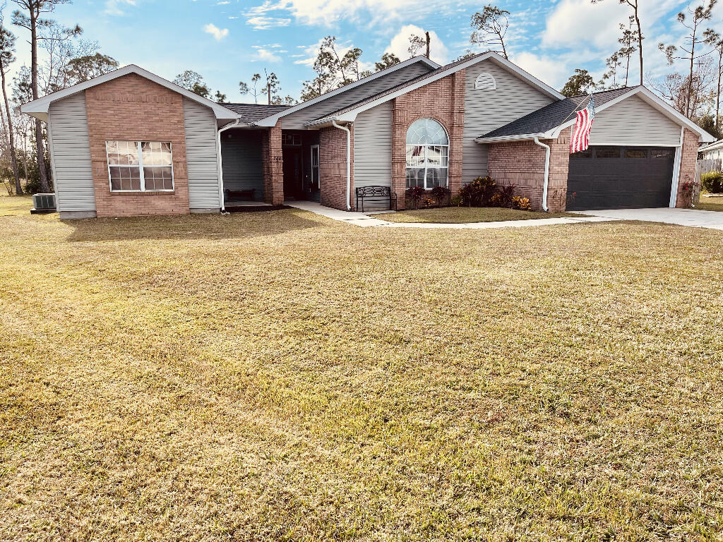 Stunning executive home on a cul-de-sac in the waterfront community of Plantation Point. Just minutes from Tyndall AFB, schools, shopping, boating, fishing, and the beach. This home has TONS of upgrades and add-on features. Huge yard, new architectural shingle roof (2019), new siding (2019), new AC (2021), new gas furnace (2021), and a new Rinnai tankless gas water heater (2020) so you NEVER run out of hot water. A very large private back patio opens to the spacious back yard, firepit, and detached 20x12 shed. Gorgeous laminate flooring and ceramic tile throughout ensures low maintenance. The covered front porch leads through the main foyer into the open plan living and dining area.
