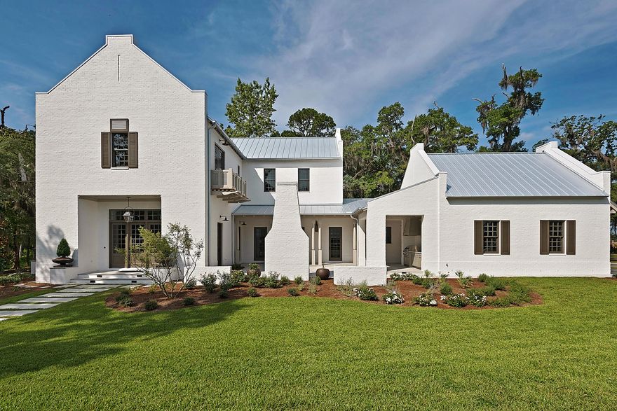 This developer model home was just completed and is open daily! The amazing architecture in Churchill Oaks just keeps getting better. This incredible 4 bedroom, 4.5 bath custom residence designed by Savoie Architects epitomizes the active healthy lifestyle available in Churchill Oaks. White painted brick exterior with parapet walls, open courtyard and outdoor living, open interior floor plan, and downstairs master suite all located on a premium corner lot with bay views ensure this will be an iconic home in the community. Recently hand picked by the editors of Southern Living as the only Southern Living Inspired Community on the Emerald Coast, Churchill Oaks exudes charm, taste, and Southern spirit; the perfect place for families to gather, interact, and call home.