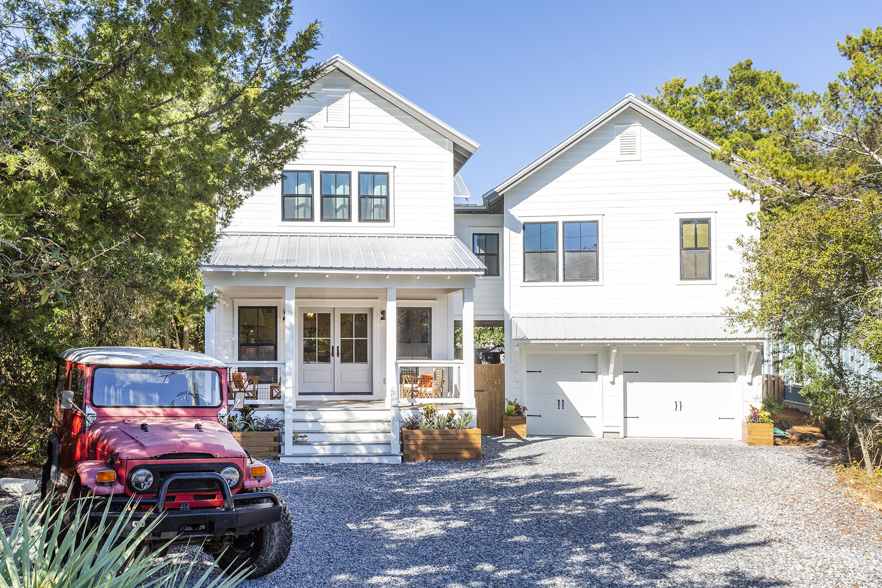 Located in the highly popular community of Old Seagrove Beach, this beautiful coastal-farmhouse style home has recently undergone a complete top-to-bottom transformation and update of the main house. The restoration also encompassed an expansion of living space to include a newly constructed, attached carriage house that now gives the home two additional bedrooms and baths, a bunk room, media, and home office area. The first level of the new addition features a 1.5 car garage on the street facing side and an inviting pool house in the rear that opens out to a salt-water pool and oversized back yard providing plenty of space for gathering and entertaining. The pool house features a comfortable living area, small kitchen, wine cooler and full bath.