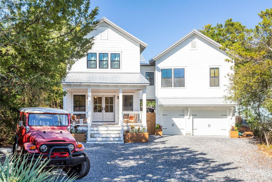 Located in the highly popular community of Old Seagrove Beach, this beautiful coastal-farmhouse style home has recently undergone a complete top-to-bottom transformation and update of the main house. The restoration also encompassed an expansion of living space to include a newly constructed, attached carriage house that now gives the home two additional bedrooms and baths, a bunk room, media, and home office area. The first level of the new addition features a 1.5 car garage on the street facing side and an inviting pool house in the rear that opens out to a  salt-water pool and oversized back yard providing plenty of space for gathering and entertaining.  The pool house features a comfortable living area, small kitchen, wine cooler and full bath.