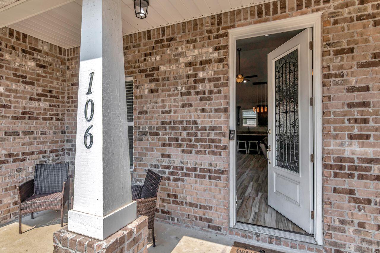 All-Brick 2021-Built Home is located in West Mary Esther, about 5 miles from Hurlburt Field. Wynnhaven Beach Estates is a NO-HOA community. The property is located on a 1/3-acre corner lot and features an open-concept layout with a split bedroom plan. The spacious living, kitchen, and dining areas, as well as the halls and laundry, are adorned with beautiful wood-like ceramic tile flooring.The living space is made more enjoyable and visually pleasing with cathedral ceilings. A large granite island also doubles as the main dining table with four bar stools that fit comfortably around it. The kitchen is equipped with stainless steel appliances, wooden cabinets with soft-close hardware, a pantry closet & beautiful granite countertops that match the island. Covered porches front & back! Offering ample space for pools, BBQ's, outdoor furniture, fire pits and more! The guest bedrooms have neutral-toned carpet and a shared full hall bath area with granite counters and wood cabinetry.
The spacious main bedroom is also carpeted, with an elegant raised and trayed ceiling. The adjacent bath features a double vanity, a separate shower and tub, and a huge walk-in closet. For parking, there is an oversized 2-car garage and driveway space for several vehicles. And if you need more space, the huge lot has room for an RV pad. The backyard is large and level and completely fenced for privacy. Not only is this home gorgeous, but it's also energy-efficient and can save you money on utilities and insurance. Call today!