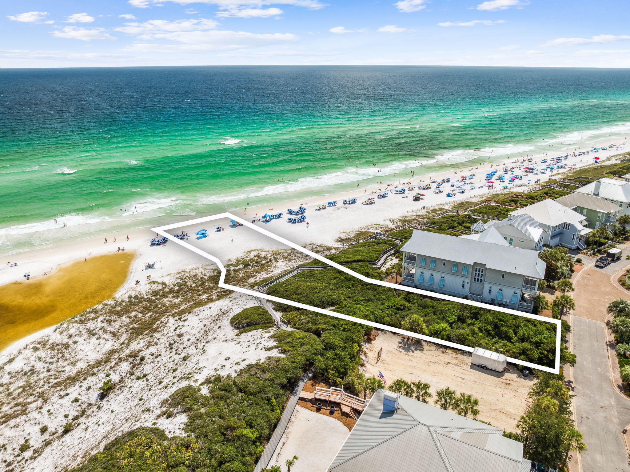 Build your dream home on this spectacular Gulf front lot in the private and gated community of Old Florida Beach, one of the most serene and sought-after neighborhoods along 30A. This rare offering features 65 feet of direct Gulf frontage and is perched on a naturally elevated bluff, providing both stunning views and added protection for the property and its native vegetation. Located in an X flood zone, the lot offers peace of mind with no flood insurance required and no risk of obstructed views. Enjoy the charm of a quiet, coastal community with deeded beach access, walking trails, and proximity to shopping, dining, and entertainment in Gulf Place and Seaside. This is a rare opportunity to secure a premier piece of 30A waterfront-perfectly positioned for privacy, security, and timeless sunsets.