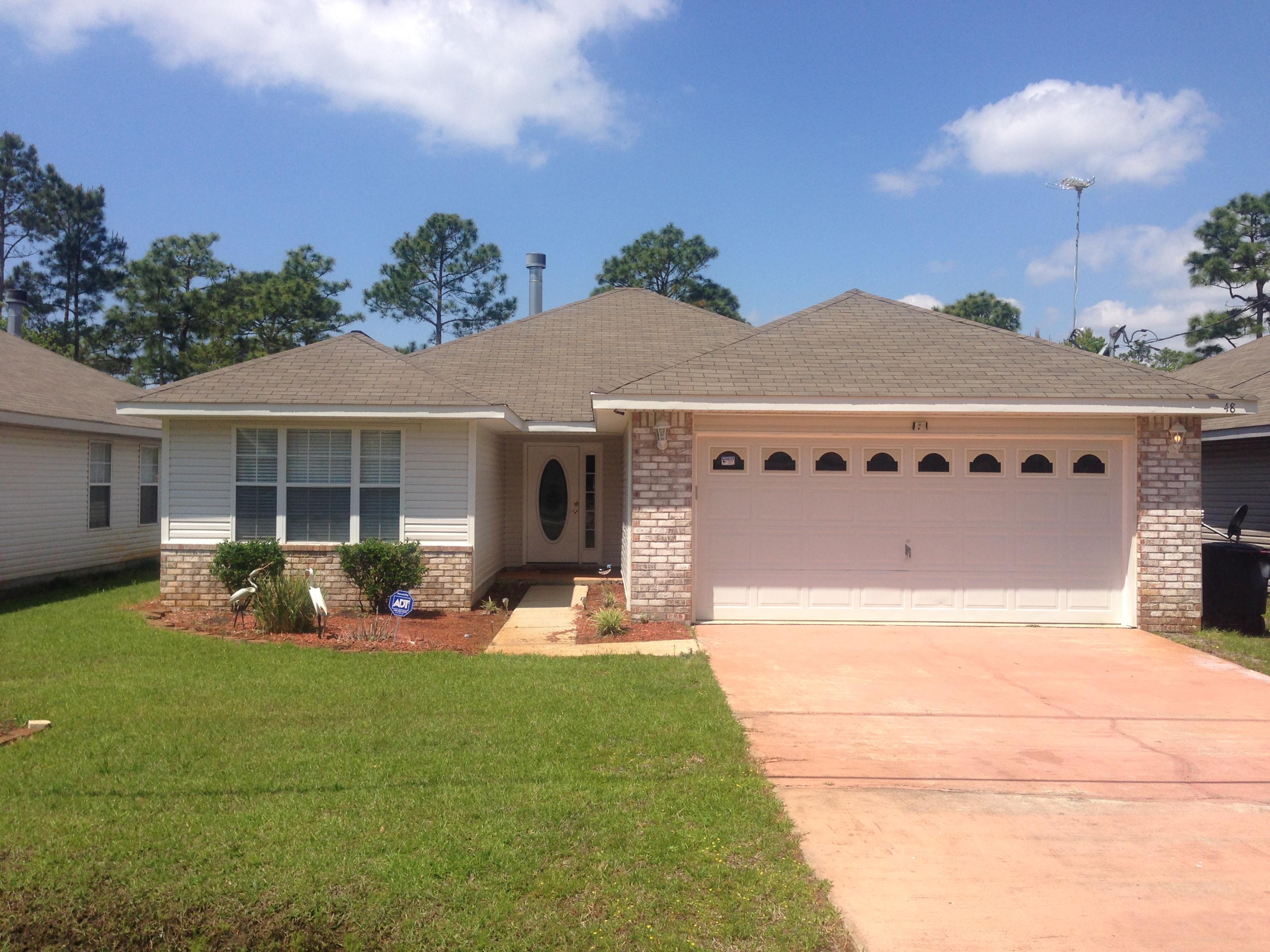 MOVE IN READY!! Lower county taxes, only 1 mile from the Mid-Bay bridge and Bluewater Bay. As you walk into this home you are greeted with a large, hardwood floored living room. To your left are the two additional bedrooms that share the second bath. As you walk through the living room, there is a wood-burning fireplace to your left. The open floor plan leads your eyes to the formal dining room and the large kitchen. The master bedroom with trey ceiling and crown molding is off of the dining room. There is a large double vanity in the bathroom, garden tub, and walk-in closet. The massive backyard is fenced in featuring sprinkler system and well pump. Relax on the screened-in covered porch as you walk out of the French doors from your dining room.Seller will provide 1 year home warranty.