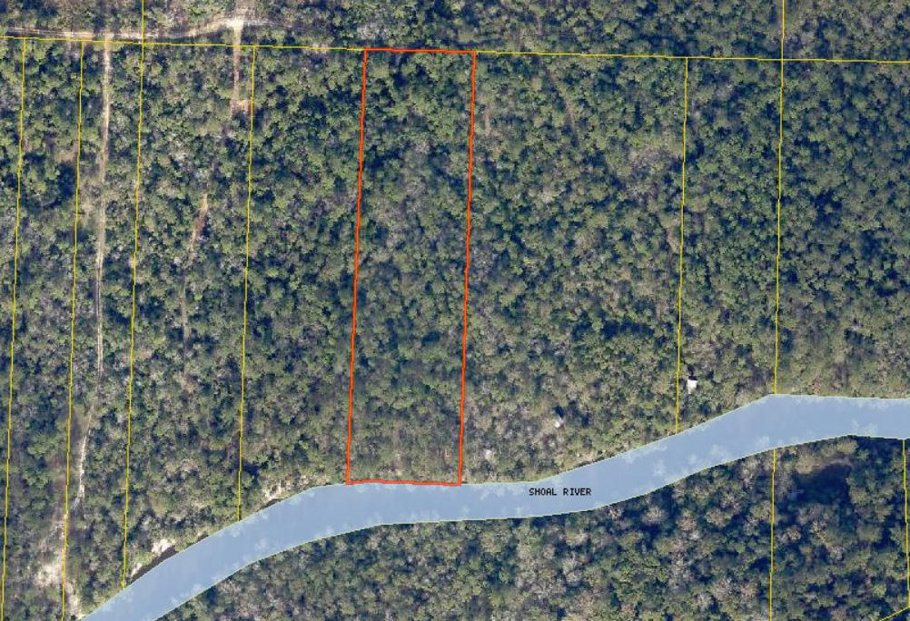 4.15 WOODED ACRES WITH 220 FEET FRONTAGE ON THE SHOAL RIVER IN NORTHEAST CRESTVIEW