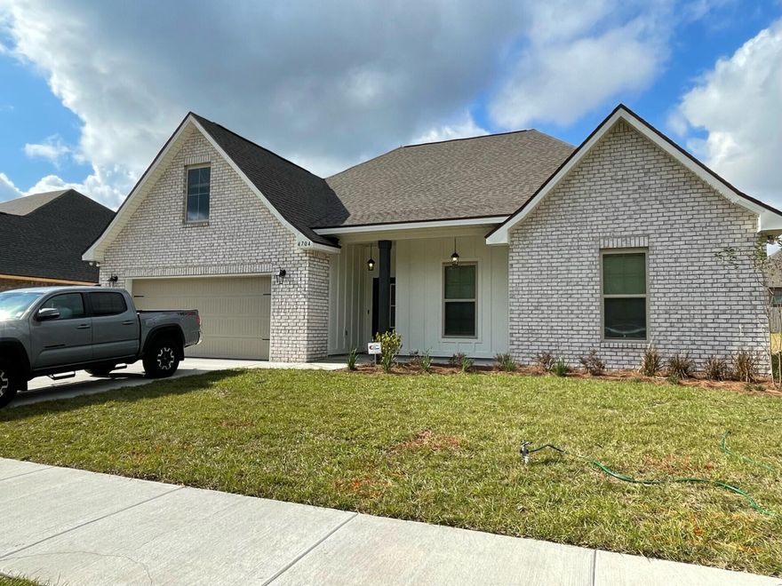 The CAMELLIA V H in Patriot Ridge community offers a 4 bedroom, 2 full bathroom, open and split design. Upgrades added (list attached).
Features: double vanity, garden tub, separate shower, and walk-in closet in master suite, kitchen island, walk-in pantry, boot bench in mudroom, covered front porch and rear patio, recessed lighting, crown molding, ceiling fan in living and master, framed mirrors in all baths, smoke and carbon monoxide detectors, landscaping, architectural 30-year shingles, flood lights, and more!
Energy Efficient Features:  electric water heater, a kitchen appliance package with a electric range, vinyl low E MI windows, and more! Energy Star Partner.