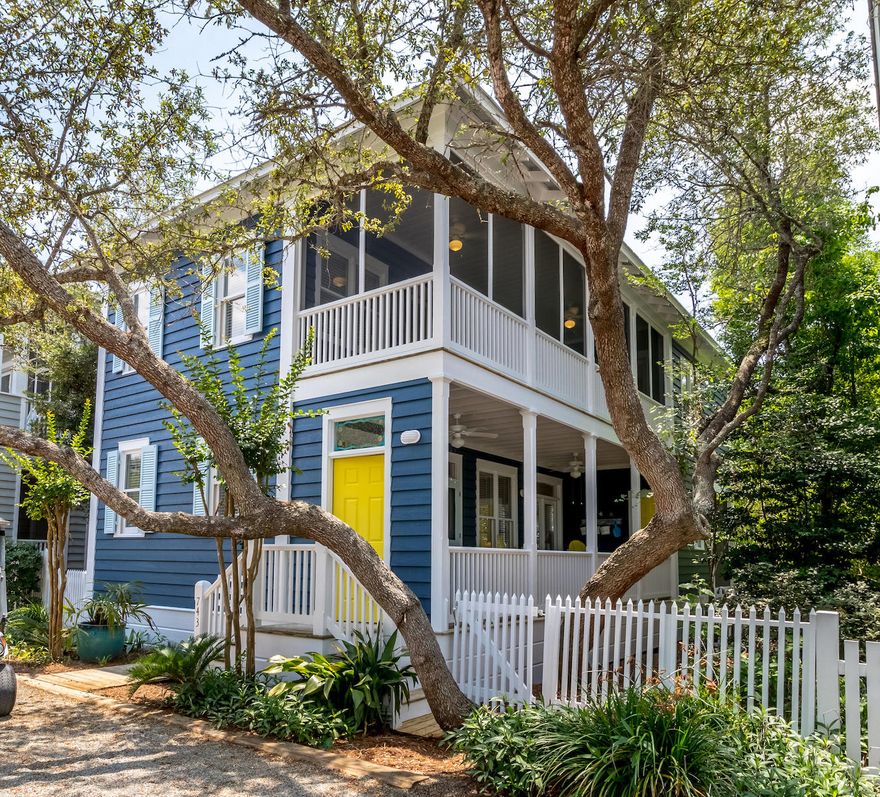 Just for Fun has all the charm of a traditional Florida beach cottage. Open floor plan on the first level integrates living/dining/kitchen spaces along with a full bath. Two sets of French doors open onto the front porch and another set of French doors open onto the screened porch at the rear of the cottage. The living room fireplace will take the chill off on a cool winter's evening. The first floor is bright, light, open and airy. The dining area and kitchen with extended countertop can accommodate an extended family. Black & white ceramic tiles enhance the kitchen backsplash with a pop of color. Upstairs, the spacious master bedroom with private bath has a vaulted ceiling. Two additional guest bedrooms share a second full bath. Another screened porch can be accessed from the