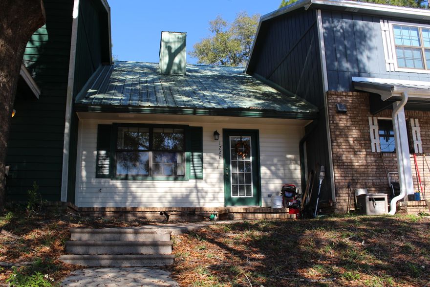 Cute townhouse in a great central Crestview location that is very close to schools! This home features a two bedroom, two bath split level floor plan. As you walk through the front door you are greeted with soaring ceilings opening up to the second floor. The living room features a wood-burning fireplace to really keep you warm this winter. The additional bedroom is downstairs with full bath and access through the kitchen. Master bedroom upstairs is really spacious. This townhome features an open concept kitchen with tons of countertop space and a laundry room with plenty of storage cabinets. The laundry room leads out to your fenced-in backyard and open patio area.