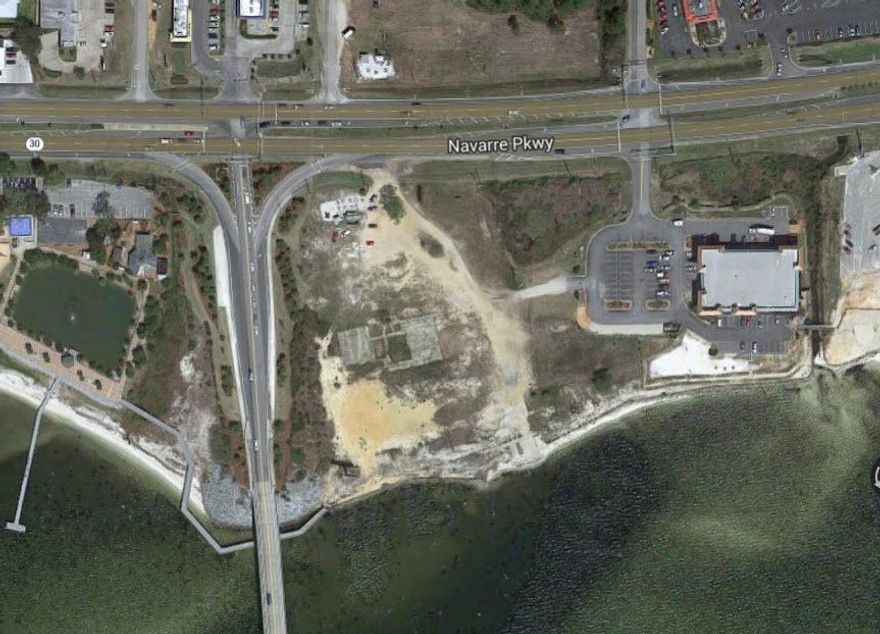 REO. Two commercial parcels on Highway 98/Navarre Parkway. Excellent frontage.