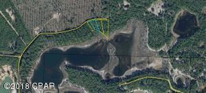 The last lot on the lake at the end of Woody Marion Dr. Here is a lot priced to sell if you want to live on the lake. Where else can you buy almost 3/4 of an acre lakefront for only $8,000?? All four lots can be bundled for $29,000. Owner financing is available All measurements are approximate.