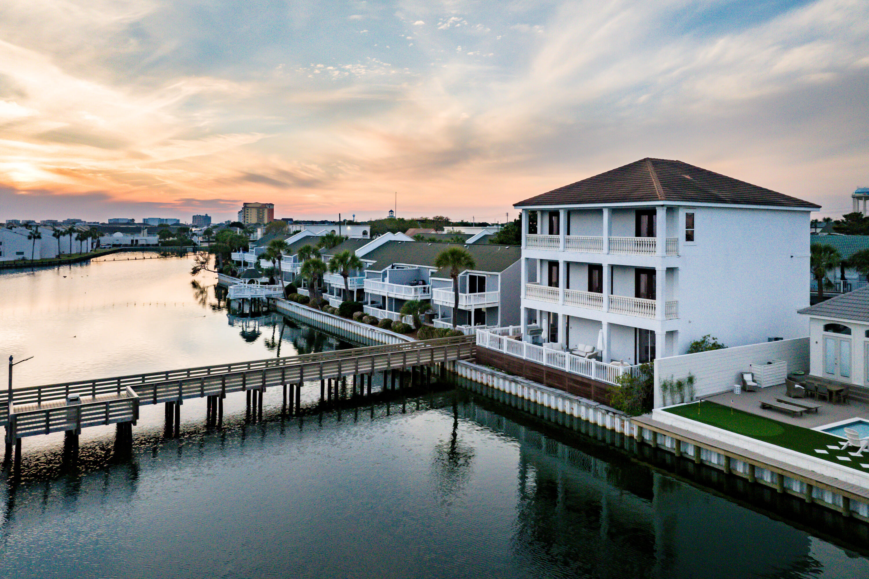 'Deeded Private Beach Access, Gated Community, Projected Rental Income 213K'Introducing Local Rhythm in the vibrant heart of Destin, FL! This exquisite 8-bedroom, 6-bathroom lakefront home is a rare gem offering unparalleled luxury, comfort, and convenience. Located in a prime location, just a short 5-minute walk from the beach, this stunning residence offers the perfect blend of modern elegance and waterfront living.Inside, you'll find spacious living areas bathed in natural light, creating an ideal space for both relaxation and entertaining. The gourmet kitchen is a chef's dream, featuring top-of-the-line appliances, plenty of counter space, and stylish finishes throughout. Enjoy your meals in the formal dining room or outside on one of the three expansive decks, each providing awe-inspiring views of the serene lake and stunning Destin sunsets. The property is turnkey ready, offering you immediate enjoyment or rental income potential. Step outside to your own private beach, just steps from the property, and enjoy tranquil afternoons by the water or taking a dip in the sparkling lake. The gated community also features a community pool, providing a resort-like experience for both relaxation and recreation.
You'll also love the convenience of being nearby shopping and a wide variety of restaurants, ensuring you'll never run out of things to do. Whether you're after peace and privacy or an active lifestyle, this home offers the ultimate in luxury and coastal living.