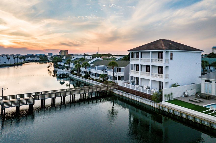 'Deeded Private Beach Access, Gated Community, Projected Rental Income 213K'Introducing Local Rhythm in the vibrant heart of Destin, FL! This exquisite 8-bedroom, 6-bathroom lakefront home is a rare gem offering unparalleled luxury, comfort, and convenience. Located in a prime location, just a short 5-minute walk from the beach, this stunning residence offers the perfect blend of modern elegance and waterfront living.Inside, you'll find spacious living areas bathed in natural light, creating an ideal space for both relaxation and entertaining. The gourmet kitchen is a chef's dream, featuring top-of-the-line appliances, plenty of counter space, and stylish finishes throughout. Enjoy your meals in the formal dining room or outside on one of the three expansive decks, each providing awe-inspiring views of the serene lake and stunning Destin sunsets. The property is turnkey ready, offering you immediate enjoyment or rental income potential. Step outside to your own private beach, just steps from the property, and enjoy tranquil afternoons by the water or taking a dip in the sparkling lake. The gated community also features a community pool, providing a resort-like experience for both relaxation and recreation.

You'll also love the convenience of being  nearby shopping and a wide variety of restaurants, ensuring you'll never run out of things to do. Whether you're after peace and privacy or an active lifestyle, this home offers the ultimate in luxury and coastal living.

 