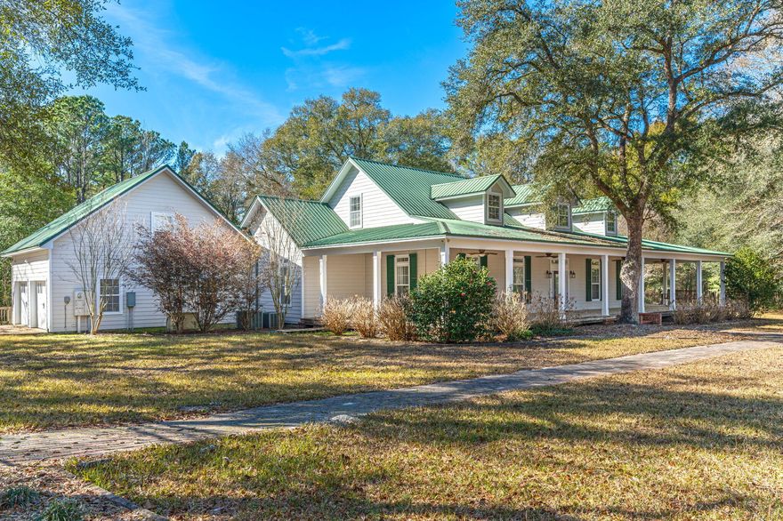 This Southern Charmer 130 acres and a custom-built farmhouse-style estate is a real hidden gem here in North Walton County. 130 acres surrounded by pastures, multiple barns, and massive oak trees Workshop, 4 wells, and 3 septic tanks. Notice the 12 ft wrap-around porch with multiple porch swings! Step into this breathtaking home where the flooring was hand-cut from the trees on this very property! Built-in bookshelves on the staircase lead you upstairs to an office nook, full bathroom, game room, and two bedrooms. The Luxurious Kitchen features Double kitchen islands both with sinks, a subzero refrigerator, a Thermador gas stove, a pot filler, a double oven, a microwave, and an icemaker...