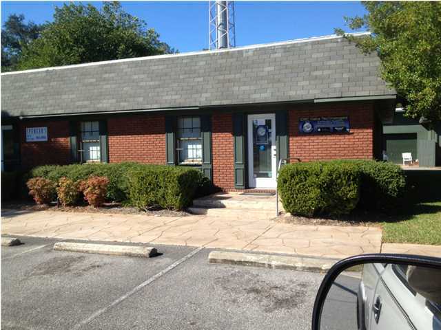 This unit features a showroom with laminate wood flooring, two offices and a reception area.