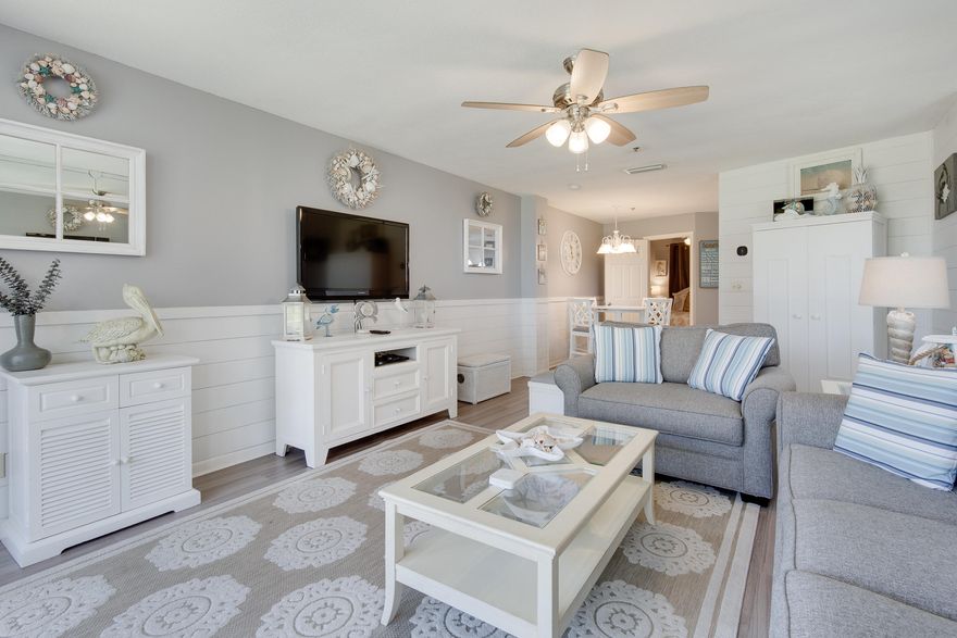 This is one of a kind! Adorable one bedroom ground floor condo just steps from the beach & owner's covered parking. It has been completely renovated. The floors are all laminate for easy beach use & the bathroom has custom tile. The unit is being sold fully-furnished & rental ready. Other features are laundry room with full-size washer & dryer, a lovely shaded deck overlooking a lushly landscaped green space, & a peekaboo view of the Gulf of Mexico. Mainsail is a guarded gated community with amenities that include: 700 feet of deeded beach, two pools, tennis courts, pickleball courts, basketball court, shuffleboard courts, fitness room with vending machines, covered parking, & courtesy security patrol. Conveniently on Scenic Gulf Drive across from Silver Sands Outlet Mall & near fine dining, shopping, golfing, fishing, & the best water recreational sporting activities along the Emerald Coast.