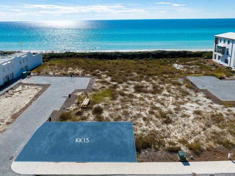 This incredible Gulf view homesite is now available for purchase in the famed KK Block of Alys Beach. Architect Gary Justiss has designed an architectural masterpiece, which will convey with the sale if desired (plans are attached). All plans have been fully approved, and construction can commence upon Buyer's readiness.  Homesite KK15 is centrally located in the HEART of ALYS BEACH.  Conveniently situated between the private owner's Beach Club and the Gulf Green, this premier bookend homesite fronts Sea Garden Street, corners the Sea Garden Walk Pedestrian Path and provides direct access to the beach from your front door.Homesite KK15 allows for a 3 story custom home as well as a 4th story roof terrace that can accommodate a roof top pool & summer kitchen if desired.  Cherish forever views of the Gulf of Mexico from inside and out on the 2nd, 3rd and 4th levels. The plan provides for private guest quarters (architectural designs are drawn for both a 2BR or 3BR 1st level- buyers choice) with a separate entrance, full kitchen, laundry and living area. This chic Gary Justiss design boasts 4BR/ 6BA , 3,947 SF of conditioned living space (or 5BR/6BA, 4,240 SF), an incredible open floor plan, 2 car garage, elevator, fireplace, butler's pantry, a roof top pool as well as a multitude of balconies and terraces throughout your home.  Along with an oversized guest suite on the 3rdlevel, the remainder of this floor is dedicated to a breathtaking primary suite with 270 degrees of incredible views, dual closets, a coffee nook as well as a private office and balcony overlooking the Gulf.

This corner condition homesite allows for an abundance of natural light giving way to incredible sight lines of the water and the architecture that has made Alys Beach the destination of destinations. The open and airy design is ideal for full-time living or large family gatherings. It's time to live life to the fullest, make family memories and enjoy all that Alys beach has to offer. This is an incredible purchase opportunity that will not last long.
