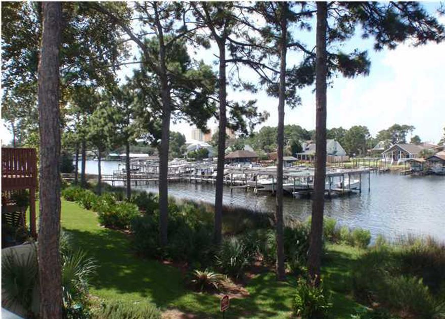 REO. Waterfront 2 bedroom, 2-1/2 bath Grand Lagoon townhouse with boat slip and lift. This is an end unit with outstanding waterfront views. The list price is based on seller renovating the unit. If you would prefer to make your own renovations, the list price is $235,000. Wonderful lagoon views! Please measure, if important.