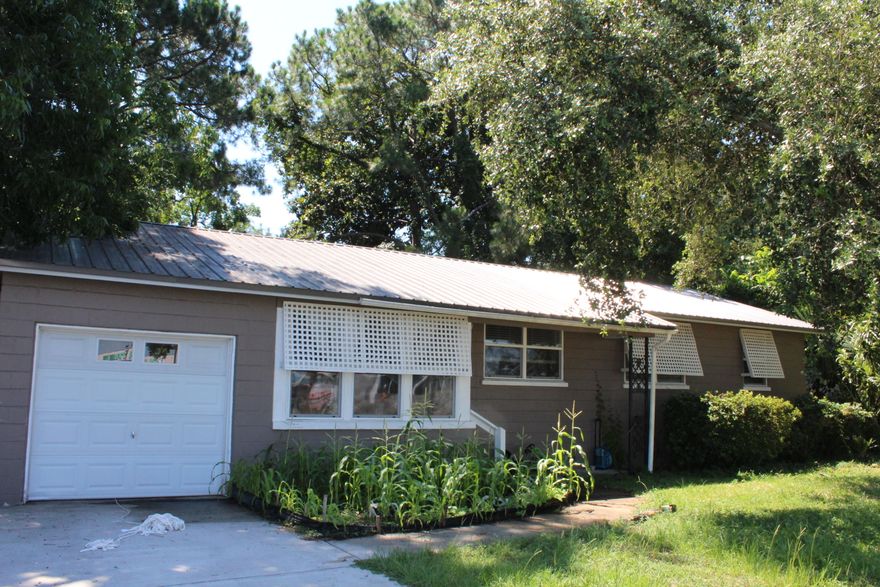 Adorable 4 bedroom / 1 bath home in the desirable Garnier's Beach neighborhood with 1260 sq ft! This home is very close to the beaches, restaurants, and shopping in Fort Walton Beach. The home has a metal roof was installed in 2009 making it 11 years old! The home also features newer double pane windows! The interior has shiplap ceilings, recessed panel doors, base and crown molding in some rooms! The kitchen has been updated to include newer light fixtures, cabinets to the ceiling with crown, new counter tops, new tiled back splash, new tile flooring and kitchen cabinet hardware. The appliances include a built in microwave, electric stove/oven, and refrigerator.