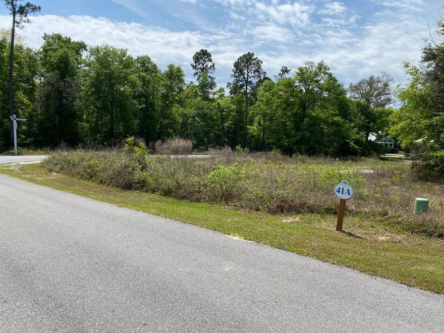 Bear creek is located in Freeport, FL and convenient to the beaches of South Walton and 30A. This is a premium corner lot located across the street from the tennis courts.