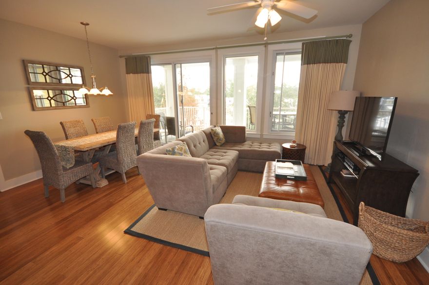 Location, Location, Location. This is a premier 3rd floor lock-off floor plan in Observation Point North above The Marlin Grill overlooking The Events Plaza In The Village At Baytowne Wharf. Beautifully updated with warm hardwood flooring, flat screen tvs and modern coastal style furnishings. This condo is ''A'' rated on Sandestin Rental Program which maximizes the potential rental income if you chose to use as a rental property. You will also be on the same floor as the amenity terrace which boasts a resort style pool, hot tub, fitness center, and a beautiful lawn with a grilling area. In addition, owners have access to the Founder's Club, a privately keyed suite for owners complete with pool table, large screen television, full kitchen and balcony overlooking the events plaza.