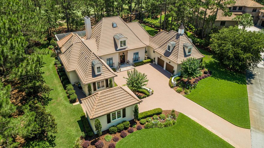Exquisite Country French inspired home is nestled on an estate size lot in a private cul de sac in the exclusive Merion neighborhood within Burnt Pine. Enhanced to perfection with beautiful architectural details throughout. Spacious Master Suite, on the main level with Ensuite bath, sitting area, cozy fireplace,& built in cabinetry. Chefs kitchen with vaulted ceilings & exposed beams, shiplap accented walls, Thermador 6 burner range, butlers pantry, center island with built in ice maker, & coffee bar with built in refrigerated drawers. Oversized family room with custom designed fireplace mantel & warm hardwood flooring. Fabulous outdoor Enclosed Lanai with Resort style Pool & Spa, beautiful lighting & water features. Summer kitchen with Authentic Italian Pizza Oven. Remarks continued... Freshly painted exterior May of 2020 using elastomeric in a soft, elegant white palette. As an added feature, this home includes an oversized finished Bonus Room with built in window seats located above the garage with access from inside. 