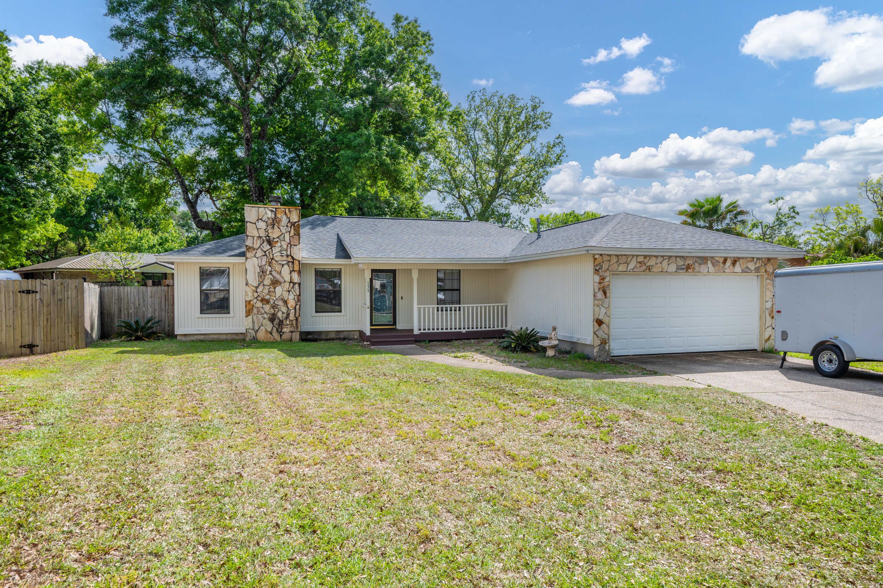 3 Bedroom 2 Bath with an office, 2 car garage, large back yard located on a cul de sac. The sellers have updated the house with a new roof 2022, new water heater 2022. The kitchen has been upgraded with new dark shaker cabinets and granite countertops, Stainless appliances and shiplap on the walls. The living areas have tile and carpet and a trayed ceiling. The guest bathroom and master bathroom, both have culture marble tubs, with tile flooring. The laundry room was updated with shiplap. The master bedroom has tile flooring and large walk in closet and a door that leads to the back patio for your convenience. The back yard has a large deck, and is fully fenced in. This home is located minutes from Destin beaches, Shopping, or to Eglin AFB and Duke field.