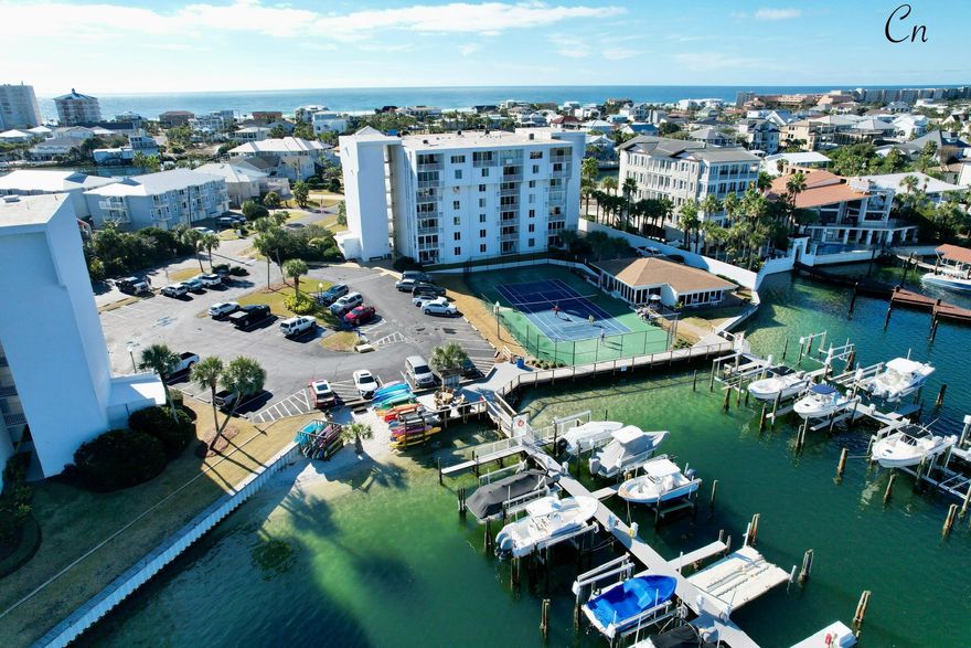Welcome to Your Slice of Coastal Paradise! Discover the perfect blend of boating and beachside bliss in this sunny end-unit retreat, nestled along the serene harbor waters of Destin. With exclusive deeded beach access just a short stroll away, you can spend your mornings on sugar-white sands and your evenings cruising the harbor by water taxi to waterfront dining, shopping & entertainment. Inside, this spacious condo offers two private split-bedroom suites--one with a king bed, the other with two queens--each with its own full bath for maximum comfort and privacy. Enjoy the added convenience of two large storage closets and soak in the sea breeze from your own private balcony with great Views! Resort-style amenities include: Private deeded beach access, Heated pool & Private waterfront clubhouse, Marina with paddleboard/kayak launch, Boat slips available for purchase or rent, Pickleball & tennis courts, BBQ grilling area, Golf cart parking, 24-hour surveillance, onsite management & upcoming gated entry for added privacy & security. Whether you're looking for a weekend escape, a proven investment rental or a full-time coastal lifestyle, this harbor front gem checks all the boxes for comfort, convenience, and classic Destin charm. Call for your private showing today! 

