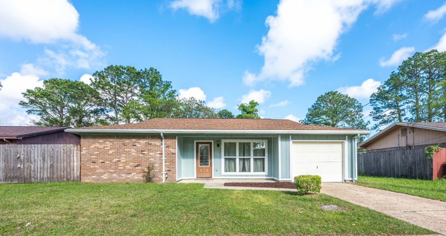 Entering your 3 bed / 2 bath ranch-style home, note the abundant light from the triple bank of windows at the front of the house that couples with light from the french doors at the rear of the home, illuminating the open, tiled living space.  The living room and dining room open at the rear of the house to the galley kitchen, featuring a double basin stainless sink, black and stainless appliances, a pantry, and views of the sprawling, privacy fenced backyard, which has an open patio and stone fire pit.  At the front of the home, a small hall leads to the three bedrooms--to the left is bedroom one, and continuing down the hall, bedroom two and the full bath which features a full glass, frameless shower. At the rear of the home is the primary bedroom with full bath and large closet with double bi-fold doors.  With an attached one-car garage, covered front porch and fresh interior/exterior paint, this home is ready for you.  Located in the Green Acres area of Ft. Walton Beach, this home is situated between Eglin Air Force Base and Hurlburt Air Force Base, not far from the Fort Walton Beach Golf Club and Ft. Walton Beach Medical Center. Convenient to shopping, restaurants and plenty of things to do in downtown Fort Walton Beach and a short drive to the white sand beaches of Okaloosa Island. Contact us now to take a look.