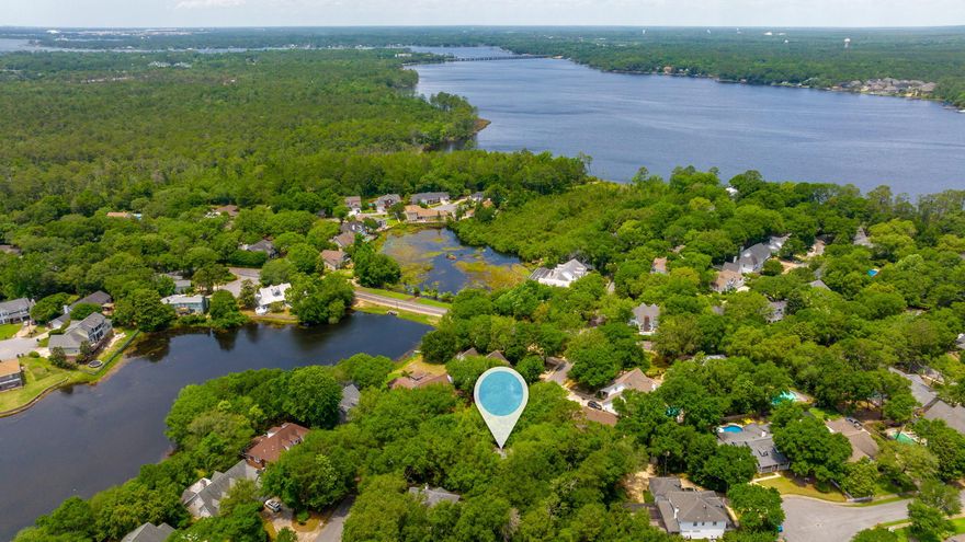 Stunning home in gated community of Bluewater Bay. You will love the newly painted walls and trim, new LPV flooring, and upgrades throughout. From crown molding to stunning chair railing, wainscoting, high ceilings, deep window casings and built in bookshelves- this home is unique and eye catching. Large living space flows into the huge kitchen with counter space and cabinets galore! Bedrooms all feature large closets, ceiling fans, carpet, and in suite access to the full bath. The loft space boasts built in bookshelves and overlooks the stunning staircase. Wrap around front porch, spacious back decks, and enormous backyard space. Even the garage features high ceilings and large garage door. Roof and HVAC are NEW!