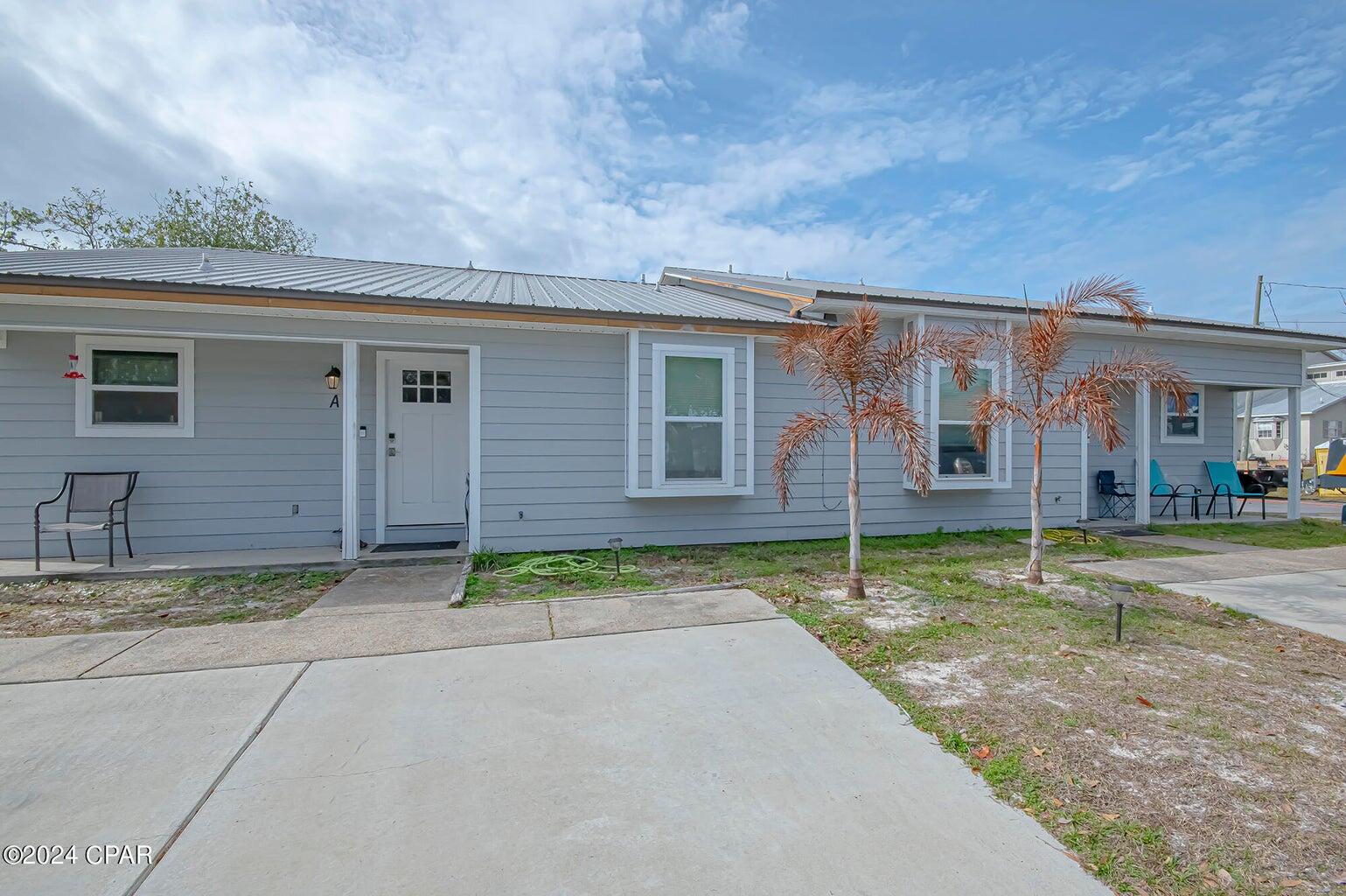 Welcome to 2712 Banyan Street on Panama City Beach. This could be your dream investment opportunity in the heart of the vibrant East end of Panama City Beach! Each side of this duplex boasts 3 bedrooms and 2 bathrooms, providing spacious and comfortable living for residents or guests. Unit B is beautifully remodeled, interior featuring Quartz Countertops, luxury vinyl plank flooring, and custom cabinets, creating an elegant and contemporary atmosphere. The fresh new paint, along with new appliances, new AC and water heater, ensure a hassle-free and comfortable lifestyle. This unit is not just a home; it's an investment gem. Currently being rented out as an Airbnb, Unit B grossed an impressive $40,000 in 2023, making it a lucrative opportunity for potential investors. Unit A, the other side of this fantastic duplex, presents an exciting opportunity for customization and value addition. The seller is offering a generous $5,000 allowance to assist in updating and transforming this unit into a stunning living space, matching the elegance of Unit B. Imagine the potential returns once both units are optimized to their fullest potential! Location is key, and this duplex doesn't disappoint. Situated in the desirable East end of Panama City Beach, residents and guests can enjoy proximity to boating, the pristine beach, and an array of restaurants. Additionally, the convenience of being just 10 minutes away from Pier Park adds to the appeal of this property. Whether you're looking for a wise investment with immediate returns or a home that offers both comfort and potential for increased value, this duplex has it all. Contact us today to schedule a viewing!